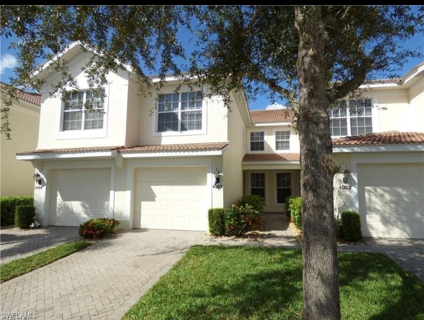 This is your chance to live in the prestigious community of Colonial Country Club, where activities and social events abound. This cute as a button carriage home is well maintained. featuring tile throughout (aside from spare bedroom), Corian kitchen counters with newer fridge and dishwasher, AC, hot water tank, washer and dryer. Includes Radon system and much more.  Sit on your tiled lanai and enjoy the beautiful sunsets over the lake. This is one you should not miss seeing.