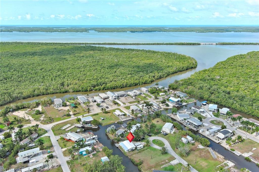 Welcome to laid-back waterfront living on Plantation Island in the Everglades City area! This charming canal-front property offers direct boating access to the Gulf of Mexico and the true Old Florida lifestyle that so many buyers are searching for. Complete with its own private boat ramp, this property is perfectly positioned for boating, fishing, and exploring the incredible waters of the Ten Thousand Islands and Everglades.

The home features updated composite/vinyl plank style flooring, a bright and inviting interior, spacious bedrooms, covered parking, and multiple bonus areas including cabana/workshop spaces perfect for storage, hobbies, fishing gear, or entertaining. Enjoy peaceful canal views right from your backyard with space for waterfront enjoyment and easy access to the water.

Plantation Island continues to gain attention as improvements and investment expand throughout the surrounding Everglades City area. The recently opened Marjory Stoneman Douglas Everglades National Park Visitor Center has brought additional visitors and renewed excitement to the region, while the community remains known worldwide for incredible fishing, boating, eco-tourism, and as the Stone Crab Capital of the World.

Whether you’re looking for a seasonal getaway, fishing retreat, investment opportunity, or full-time waterfront lifestyle, this property offers an incredible opportunity to own a piece of paradise in the beautiful Everglades.

Buyer to verify all future community improvements, utilities, and development plans.