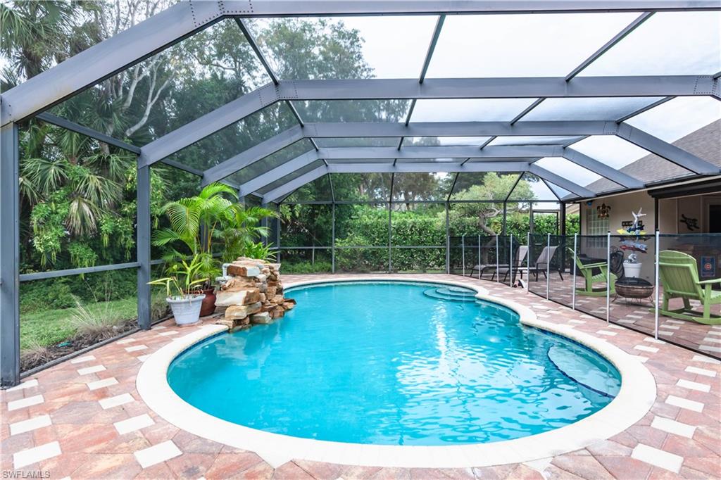 MOVE IN READY - This Beautiful 3 BR/2 BA Single Family Saltwater Pool Home with a Waterfall has been completed updated. Oversized Corner Lot with lots of privacy. Beautiful Quartz countertops with white cabinets in the kitchen and Porcelain Plank Tile throughout. Marble countertops and beautifully updated Primary Bathroom . It has Impact Resistant Windows and Doors including the Garage Door and an Electric Hurricane Resistant Screen on the lanai along with a Transfer Switch for the Generator. The AC was replaced 2 years ago and a NEW ROOF was just installed. The Pool heater is 1 year old, the Hot Tub is 1 year old and conveys with the home along with the Entertainment Center in the Family Room. The Orchards is a sought after Gated Community with LOW HOA FEES and excellent amenities which include a Resort-Style Pool with Hot Tub, Fitness Center, Tennis & Pickleball Courts, Playground and Bocce Ball. PRIME North Naples location within minutes to Beaches, Mercato, Dining and Shopping, and is in a Top-Rated School District. Don’t miss out on this MUST SEE HOME!
