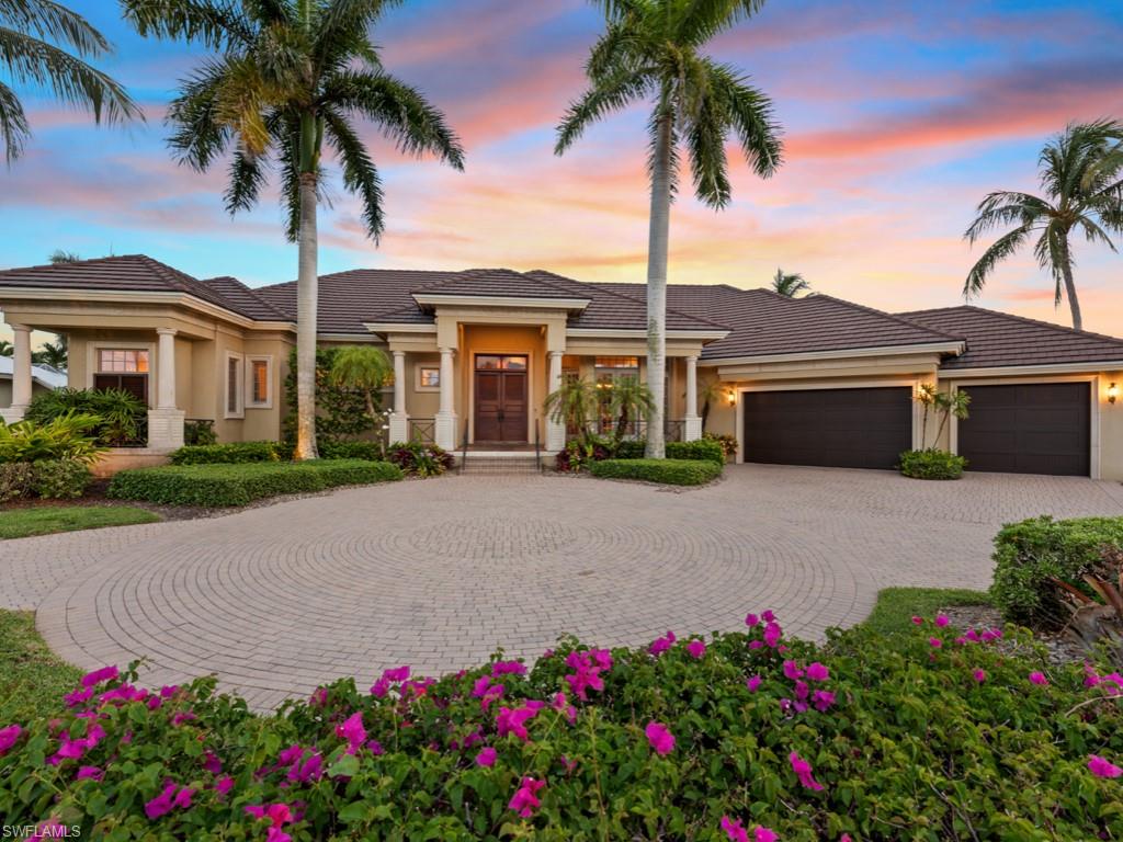 Understated elegance with coastal flair. Immaculately maintained, highly upgraded, 3-bedroom plus den, 3.5-bath, waterfront home, offered furnished, featuring direct Gulf access via Roberts Bay. Fabulous interior details include tray and coffered ceilings with wood inlays, art niches, beautiful slate floors in main living areas and lanai, plus hardwood and tile, crown molding, custom lighting and cabinetry, surround sound and beautiful furnishings throughout. Entertaining options abound; the gracious living area overlooks the lanai and pool with preferred southern exposure, adjacent butler's pantry and wet bar. Great room flows seamlessly to the chef's dream kitchen, which boasts a large island with prep sink, Wolf 6-burner gas range, Sub-Zero built-in fridge/freezer with 2 beverage drawers, built-in desk and pantry. Stunning outdoor living area with gas-heated pool and spa, gas fire pit and outdoor kitchen with grill, sink and fridge. Bring your boat; there's a 40,000-pound lift and dock with water, electric and fish cleaning station. New roof 2018, new generator 2021, 3-car garage with AC and insulated doors. Exceptional location in Marco Island on a private half-acre homesite.