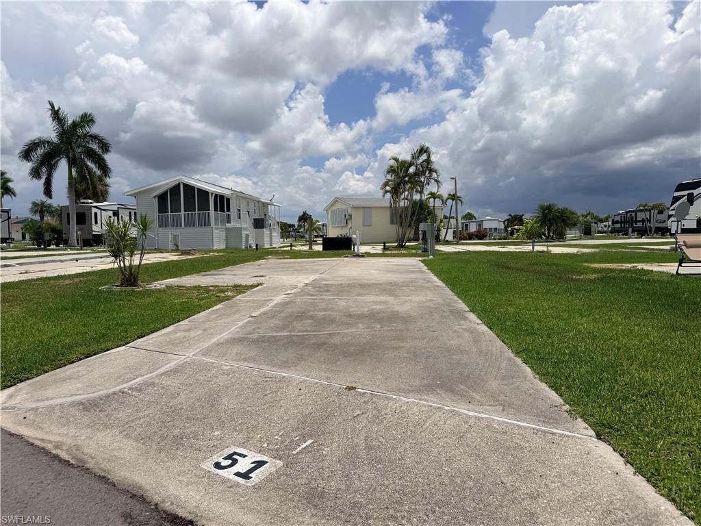 Escape to your own slice of paradise with this beautifully maintained lot featuring upgraded 30/50/120-amp electrical service and a well-groomed concrete pad, ready for your RV, or future dream retreat. Tucked away just three lots from O Street in the peaceful rear of the community, you'll enjoy a quiet, tropical setting while remaining close to all the fun. Best of all, there's no lot rent—you own the land! Whether you're parking your RV or building a manufactured home, park model, or tiny home, this is the perfect place to embrace the Southwest Florida lifestyle. Spend your days enjoying an impressive array of resort-style amenities including pickleball, tennis, shuffleboard, pool, volleyball, horseshoes, a welcoming clubhouse, and a tropical tiki pavilion where neighbors gather and island vibes come naturally. Boat storage is also available, and you're just a short bike ride or leisurely walk to Bunche Beach. Water, sewer, cable, and electric are all available within the community. Located in the non-pet section, this lot is golf cart friendly, making it easy to cruise through the neighborhood and enjoy everything Palmetto Palms has to offer. Ideally situated just minutes from the world-famous beaches of Fort Myers Beach and Sanibel, you'll have easy access to waterfront dining, fresh seafood, shopping, nature preserves, and endless opportunities to soak up the sunshine. Come discover why Southwest Florida is the perfect place to relax, unwind, and live the island lifestyle you've been dreaming of.