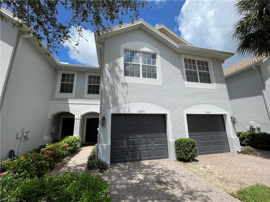 ANNUAL RENTAL - 2 BED/ 2.5 BATH TOWNHOUSE WITH 1 CAR GARAGE AT MILANO. This Naples townhouse offers an open floor plan with a white-cabinet kitchen and appliances flowing into the living area, which opens to a covered, screened lanai. The first floor features tile throughout and a convenient half bath, while the second floor has two full bathrooms, bedrooms with a walk-in closet, vinyl plank flooring, and an in-unit laundry. The property includes a one-car garage. Community amenities include a pool, spa/hot tub, tennis court, and BBQ picnic area.