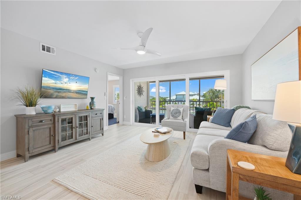 WALK TO VANDERBILT BEACH FROM THIS BEAUTIFULLY UPDATED 2BR + DEN AT MONTE CARLO CLUB — WATER VIEWS FROM BOTH SIDES! This rare dual-exposure residence captures serene bay and lagoon views from the screened lanai and shimmering Gulf and beach views from the front balcony — water on both ends of the home. Tastefully renovated and turnkey furnished in a fresh coastal palette, the light-filled, open layout includes a flexible den perfect for a home office or additional guests. Monte Carlo Club is an intimate, gated, low-rise community on the quiet north end of Gulf Shore Drive, sitting directly across from the sugar-sand of Vanderbilt Beach with deeded beach access just steps away. Residents enjoy a large heated community pool, BBQ and picnic area, tennis and pickleball, a tranquil bayside walkway, covered parking, and elevator access. Boating enthusiasts are minutes to the open Gulf via Wiggins Pass, with boat slips available within the community. Stroll to The Turtle Club, Baleen at LaPlaya, and The Ritz-Carlton; minutes to Mercato's shopping, dining, and nightlife, Delnor-Wiggins Pass State Park, and championship golf at Tiburón. SWFL International Airport is roughly 25 minutes away. Your North Naples beach escape awaits.