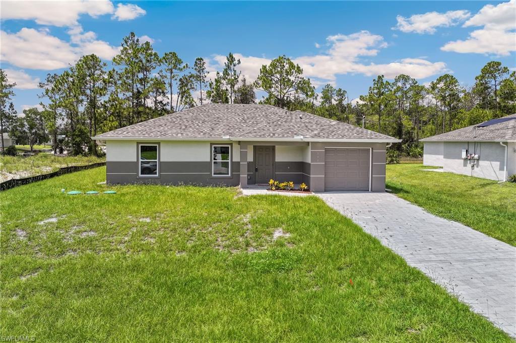 Brand-New Construction on an Oversized Canal Lot! Welcome to this beautifully crafted 3-bedroom, 2-bathroom home offering 1,258 square feet of thoughtfully designed living space in the desirable Greenbriar neighborhood of Lehigh Acres. Situated on an oversized 0.29-acre lot with southern exposure, this home provides peaceful views and stunning Florida sunsets.

The open-concept floor plan features soaring ceilings, designer porcelain tile flooring throughout, and abundant natural light. The gourmet kitchen is appointed with quartz countertops, real wood soft-close shaker cabinetry, stainless steel appliances, a glass tile backsplash, a floor-to-ceiling pantry, and a spacious breakfast bar—perfect for entertaining.

The split-bedroom layout offers privacy, while the primary suite includes a walk-in closet and a beautifully finished bathroom with quartz countertops and custom tile accents. Additional highlights include hurricane-impact windows and doors, a paver driveway, epoxy-coated garage floor and covered lanai, upgraded baseboards, designer lighting and ceiling fans, fresh landscaping, and an indoor laundry area complete with a new washer and dryer.

Conveniently located near shopping, dining, golf courses, schools, parks, FGCU, Southwest Florida International Airport, I-75, and the Gulf Coast's world-famous beaches, this move-in-ready home is an excellent choice for full-time living, seasonal enjoyment, or investment potential.