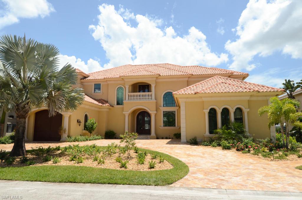 Deep Water Canal.  New Construction.  Gorgeous 2-story home, 4 bedroom suites plus large home office, 
4 full baths, 3 half-baths.  Three car garage.  Custom built-in's by LaStrada Furniture:  Great room wall unit; custom built master bed with nightstands,  columns, bridge with lighting.  Custom built beds & nightstands in other three bedrooms.  Faux painting and custom wood 2 story ceiling in Great Room; billiard room with custom wet bar & cabinetry.  Large gourmet kitchen, top of the line appliances, huge Island; built-in booth. 
Large lanai with kitchen, bamboo ceiling, BBQ gas grille.  Custom swim pool with rock waterfall, built-in bar stools in pool and gazebo--overlooking expansive canal.  Bring your 95' yacht!  Marble flooring, granite galore, lush landscaping.