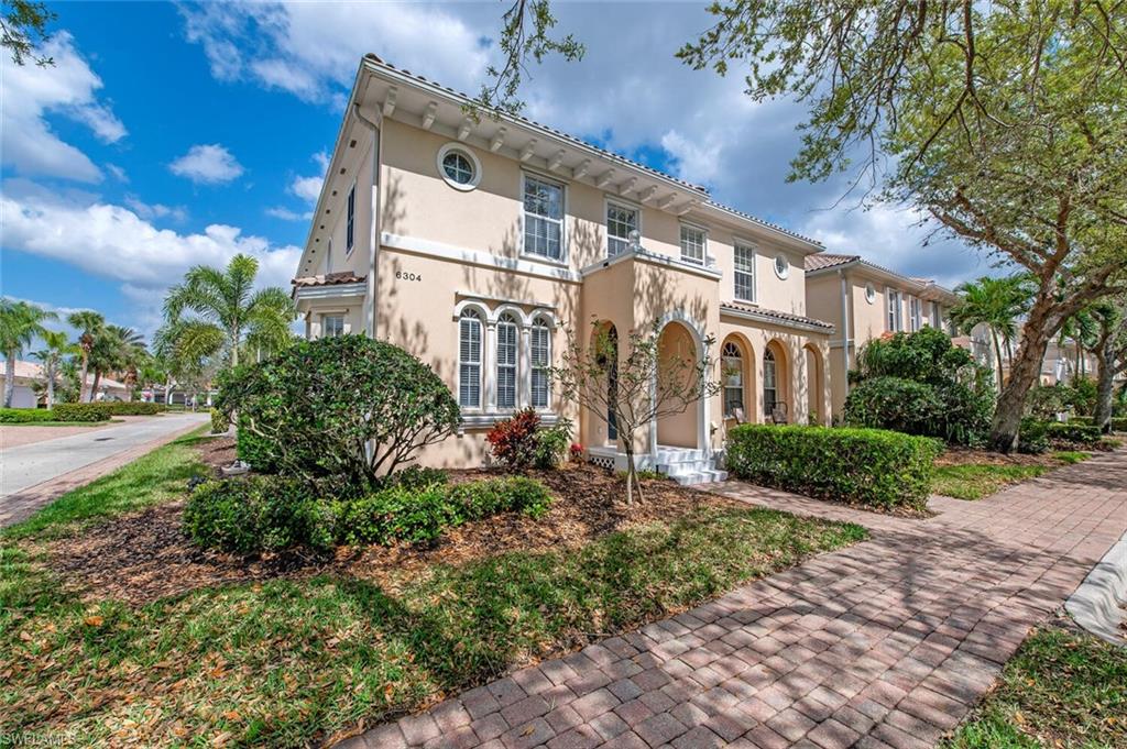 C8676. Timelessly elegant, upgraded Aruba townhome in the gated community of Island Walk within walking distance to Towncenter. This residence boasts two separate living areas, a screened-in lanai with ample privacy, a pool, and plenty of lounging/dining areas. The master bedroom suite is spacious and offers an ensuite bath with dual sinks, a walk-in shower, and separate tub.  Additional features include a 2-car garage and large guest rooms, one with a built-in desk area and Murphy bed system.  This amenity-rich community including two resort-style pools, a cafe, 8 lighted Har-Tru tennis courts, bocce, putting green, a cutting-edge fitness center, and more. Close to every convenience imaginable, with world-class beaches a short distance away. Your luxury lifestyle awaits!