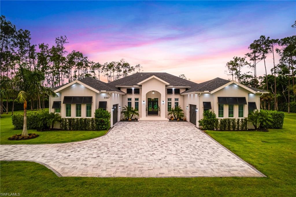Welcome to 5567 Tamarind Ridge Dr, an extraordinary estate in the highly desirable Logan Woods neighborhood. This rare opportunity allows you to own over 4 acres of meticulously manicured, private, fenced, and gated land, offering a serene retreat with unmatched privacy and luxury. The custom-built, single-story home spans nearly 5,000 square feet and has been thoughtfully designed to meet the highest standards of quality and craftsmanship. Boasting 4 spacious bedrooms, a versatile bonus room, a well-equipped gym, and a dedicated office, this home is perfect for those seeking both comfort and functionality. Every detail, from the elegant crown molding to the soaring ceilings, reflects high attention to detail and superior finishes. The heart of the home is the chef’s dream kitchen, complete with Wolf and Sub-Zero appliances, dual islands, and an expansive layout perfect for hosting gatherings and entertaining guests. Outside, the serene pool and spa create a peaceful oasis for relaxation, while the primary bath rivals a high-end spa with its luxurious soaking tub, walk-in shower, and a fully equipped steam room, offering a truly rejuvenating experience. In the rear of the property, car enthusiasts will be thrilled by the massive 10+ car garage, complete with additional storage rooms, providing ample space for an impressive collection or a workshop. This rare estate in Logan Woods offers an unparalleled lifestyle combining tranquility, exclusivity, and luxurious living—truly the perfect setting for making lasting memories. Don’t miss out on this dream property.