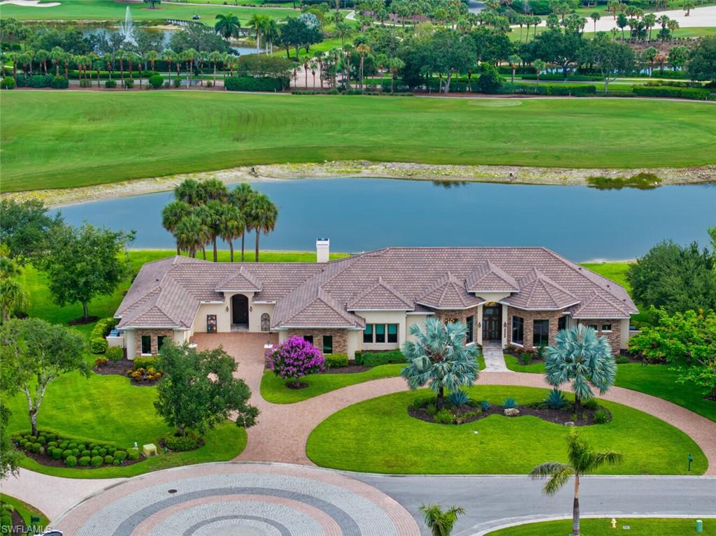 Views! Views! Views from almost every room!! A magnificent custom-designed estate, (2016), where timeless craftsmanship meets modern luxury! Showcased on one acre, overlooking the 4th fairway of Twin Eagles Golf & Country Club's revered Talon Course, this home offers sweeping views of the lake and golf course from nearly every room! An additional FOUR acres of land extend into the water and fairway, offering an unmatched sense of privacy and space. Warm, rich wood finishes, harmonized with other materials, set the tone of refined comfort and tranquility. Mahoghany and Leaded Glass doors, stained Oak trim, crown molding and solid doors, Cherry soft-close cabinetry throughout, Travertine stone gas fireplace with twisted Juniper mantel, as well as Walnut and Marble floors define the essence and character of the home.  Encompassed in 5,493sf, this ranch-style home has a sense of casual sophistication, tailored for everyday living, as well as grand entertaining. Centered around a spacious gourmet kitchen, with gas-cooking on professional-grade Wolf Appliances, including a steam oven, Sub-Zero Refrigerator/Freezer and a generous walk-in pantry, this home features 4 en-suite bedrooms, 5.5 bathrooms, a den, large game room with wet bar, two 2-car garages (4 bays) and 3 zoned HVAC systems, to mention a few. Upgrades include a whole house generator, hurricane impact glass throughout, plus electric shutters and screens for the oversized patio, for added comfort and security. Twin Eagles Golf & Country Club is abundant in wildlife and natural beauty. Residents often spot deer, wild turkeys and a variety of birds throughout the community. The Club offers a wide range of amenities, including golf, tennis, pickle ball, bocce, a fitness center with classes, a variety of hobbies, dining and social activities, for members to enjoy. Club membership is mandatory and the new homeowners can choose from golf, sports or social membership.