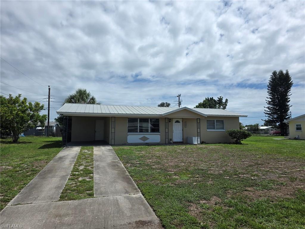 Charming 2-bedroom, 1-bath single-family home in a peaceful Lehigh Acres neighborhood. This cozy home features tile flooring throughout, making maintenance a breeze, along with a covered carport for convenient parking. Ideally located near HCA Florida Lehigh Hospital, Lee Blvd, shopping, restaurants, and everyday conveniences. Enjoy the comfort of a quiet residential area while remaining close to everything you need. Don't miss this great rental opportunity—schedule your showing today!