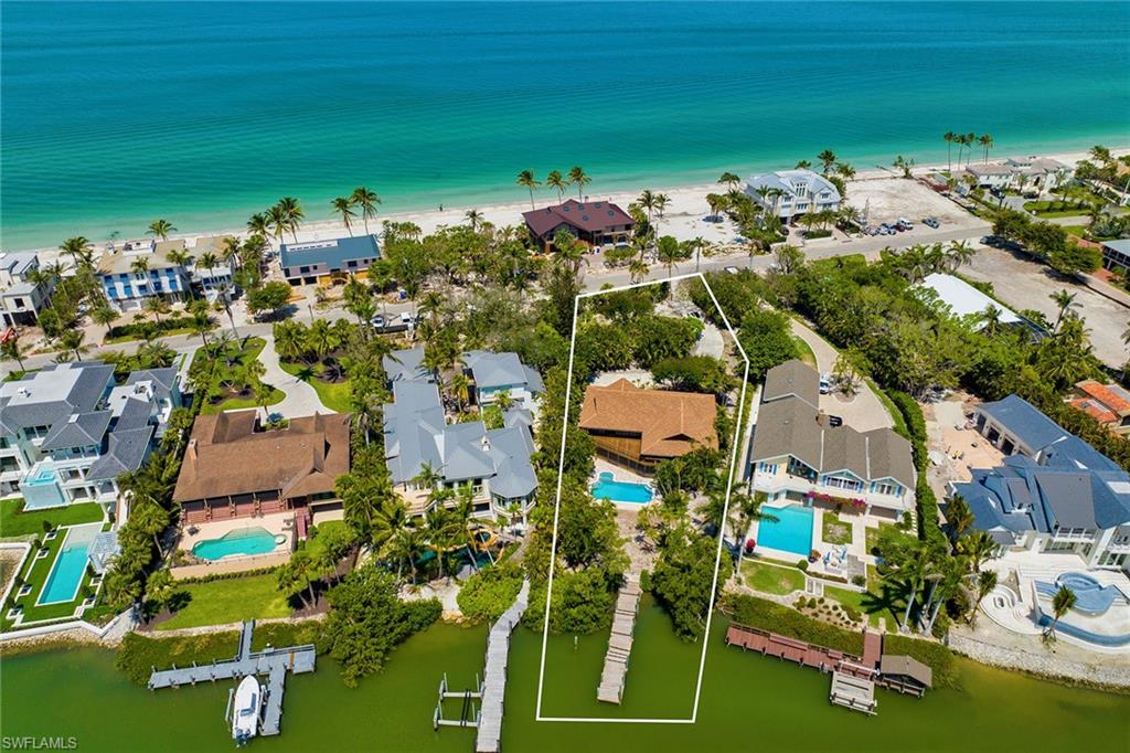 Boating and beach in a prime location on Gordon Drive! This single-family estate-sized property offers sheltered dockage for your boat and nearby deeded beach access at the quiet end of Gordon Drive. With over 250 feet of depth from Gordon Drive to the protected waters of Champney Bay, your dream home can combine the best of Naples such as sunrise and sunset views, direct gulf-access boating and eligibility for an associate membership at the Port Royal Club. Make this your legacy property and enjoy the natural beauty for generations.