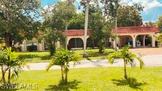 If you’re looking for a home with character, charm, and a layout unlike the ordinary, this unique house is sure to impress. Featuring an eclectic floor plan, an updated kitchen, and beautifully renovated bathrooms, this home offers a warm, inviting atmosphere with distinctive style throughout. Enjoy Florida living from the screened lanai or relax on the covered breezeway porch, the perfect spots to enjoy your morning coffee or unwind after a long day. Situated on a large parcel, the property boasts a spacious yard and a detached work shed, providing plenty of room for storage, hobbies, or weekend projects. Bring your boat, RV, work truck, trailer, or recreational vehicles—there’s plenty of room to park and enjoy the flexibility this property offers. Perfectly located in the heart of Estero, you’re just minutes from Coconut Point Mall, Miromar Outlets, FGCU, Gulf Coast Town Center, RSW International Airport, I-75, Hertz Arena, shopping, dining, entertainment, and Southwest Florida’s beautiful Gulf beaches.This is a rare opportunity to enjoy a home with personality, modern updates, abundant outdoor space, and an unbeatable location. Schedule your private showing today!