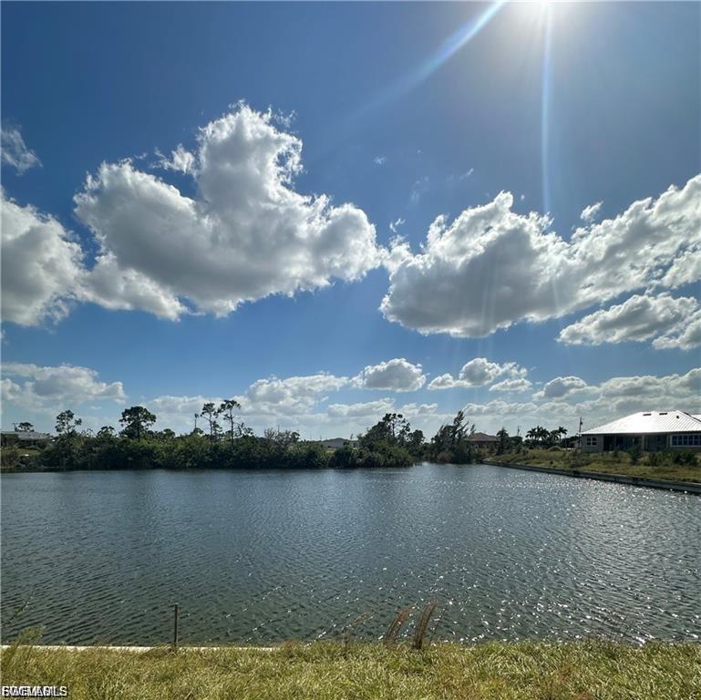 SPECTACULAR CUSTOM NEW CONSTRUCTION SITUATED ON AN OVERSIZED LAKEFRONT LOT (123 FEET OF WATERFRONT) WITH LONG AND WIDE LAKE VIEWS (TYRE LAKE) !!!! (PLUS, VIEW STRAIGHT DOWN JARKO CANAL) This 4/2/2 property has over 2000 sq. ft. of living area. High-impact glass for all windows and sliders. Brand new seawall installed. Grand 12-foot front entry with double doors. Upgraded tile throughout the property. Huge master bathroom with separate tub and walk-in shower. His and her walk-in closets. Brick paver driveway and pavers in the rear lanai. Granite countertops throughout. Solid wood cabinets. Bright and open great room design with breakfast nook, breakfast bar, and dining room. Shingle roof. Floritam sod and irrigation system. Under construction.