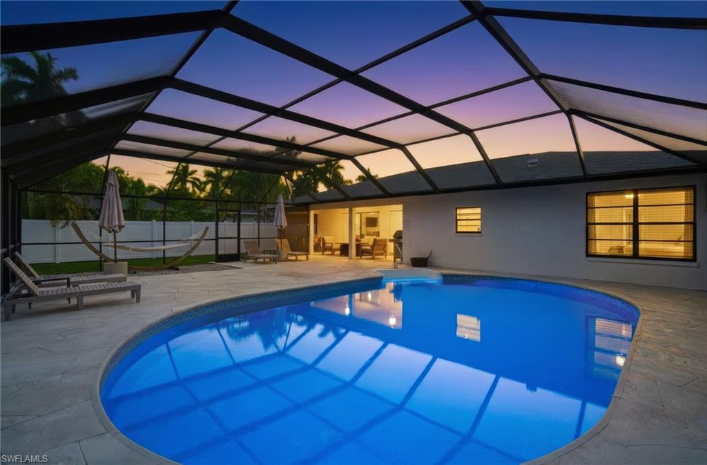Welcome to this beautifully updated pool home, just 2 miles from Bonita Beach and with no HOA, featuring $175,000 of recent upgrades. Step inside and you’ll be greeted by a bright, open-concept layout featuring a modern kitchen with quartz countertops, stainless steel appliances, and bar seating. From the kitchen, the layout extends naturally into the dining area and inviting living room. The split floor plan offers a private main suite that includes space for a home office, an updated en suite bath, and a large walk-in closet. On the opposite side of the home, two private guest bedrooms share access to a full bathroom. Not included in the square footage is a large bonus laundry room and storage area. The outdoor area includes a spacious covered lanai, oversized pool cage, large heated pool with sought-after southern exposure, along with a fully fenced yard for complete privacy. Coastal modern furnishings that highlight the home’s upgrades are included.

Located west of US 41 and south of Bonita Beach Road, this quiet neighborhood is just a short walk or bike ride from many shopping and dining options. With no rental restrictions, the property also offers excellent income potential and no flood insurance is required. Vanderbilt Drive provides easy access to Naples, with I-75 only minutes away and Southwest Florida International Airport being just 20 minutes from your doorstep.