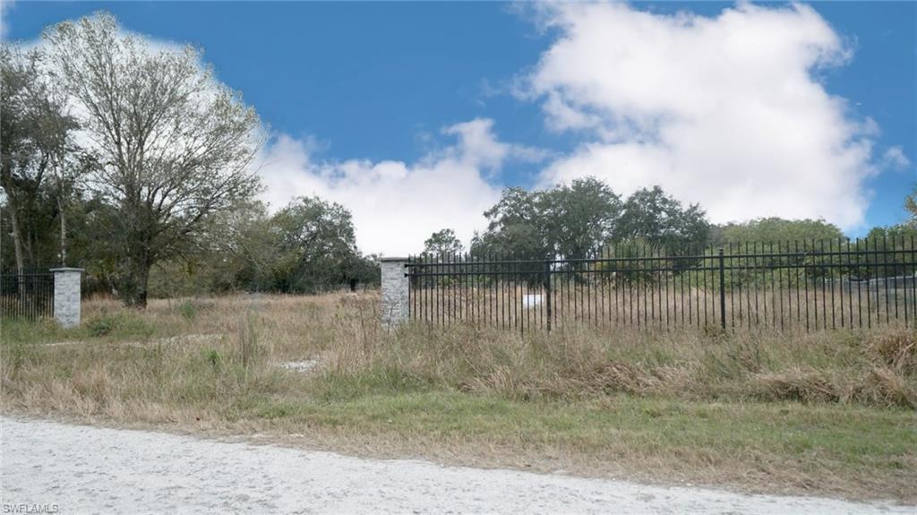 Tired of Leaving in the City??? This property is for you! ready to build a bit more than 1 acre of land 2 blocks away from a park, one side of the Road is paved, the other side it's not. The property is fenced in with beautiful Aluminum picked fence with really nice columns about 8' apart.