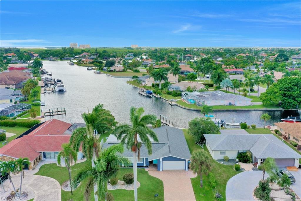 Location, location, location! Endless water views. Western exposure to really enjoy our famous sunsets. Calling on the serious boater, sailboat access, a few minutes away from the river. No expense has been spared in completely remodeling this home in 2019. New roof, re-piped and re-plumbed, new electrical lines, outlets and breaker box, added a guest bath, brand new kitchen, new appliances, new quartz countertops in the kitchen and bathrooms, new garage door with new opener, new bathrooms with modern fixtures, wood-look vinyl floor throughout the home, new ceiling fans and door bell, new pool pump and new pool heater, new water heater, brick paver driveway and walkway along side the home, new composite boat dock with expansive deck, new dock lights and electrical outlets and new landscaping. And last but not least this beautiful home is being offered turnkey! Make sure to check out the virtual tour.
