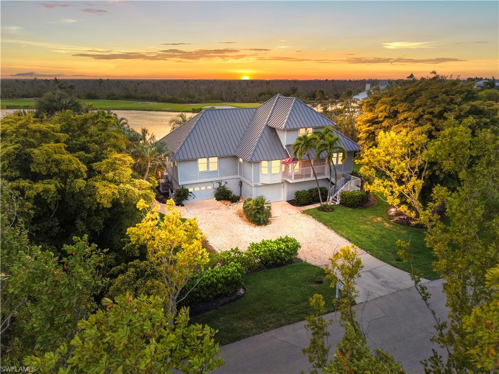Nestled within the sought-after The Dunes community, this lakeside Sanibel sanctuary offers the perfect blend of island lifestyle, privacy, and convenience. Ideally positioned on a quiet cul-de-sac along Sanderling Circle, the home showcases panoramic lake and preserve views with coveted southwesterly exposure—delivering magnificent sunsets each evening.
Designed for relaxed coastal living, the residence features light-filled living spaces and an open flow that extends seamlessly to the outdoor lanai. The main living level is warm and inviting, highlighted by a cozy fireplace in the family room—perfect for peaceful mornings or unwinding in the evening after a day enjoying all that Sanibel has to offer.
Enjoy your private pool and spacious patio, an ideal setting for entertaining or simply relaxing with family and friends in a serene island backdrop. The lower level provides generous garage space along with ample room for bikes, kayaks, beach gear, and additional storage—perfect for embracing the active Sanibel lifestyle.
Residents of The Dunes enjoy optional membership to the semi-private golf and tennis club, along with pickleball and dining amenities. Spend your days golfing, playing tennis or pickleball, or biking to Sanibel’s world-renowned beaches. With two convenient entrances and exits, this location offers easy on/off island access and close proximity to the Sanibel Causeway.

Whether you’re seeking a full-time residence, seasonal retreat, or investment opportunity, this home captures the essence of Sanibel as a true sanctuary island.