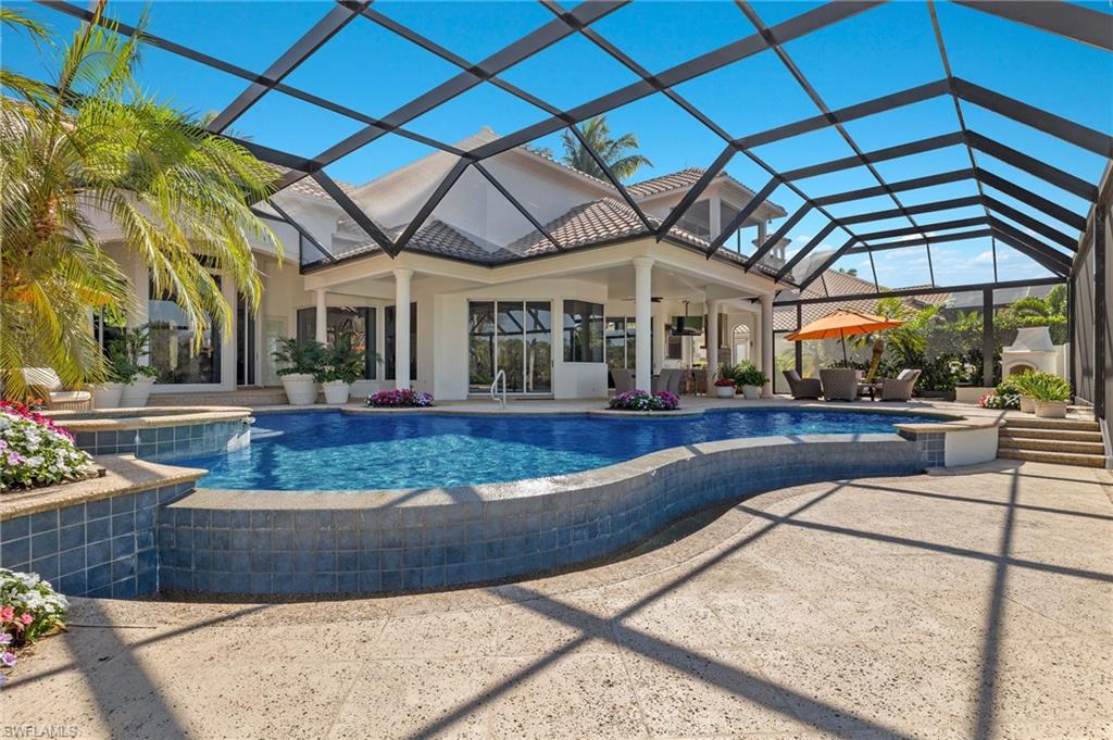 Experience luxury living at its finest in this Clive Daniel decorated Turnkey Furnished Estate Home in the prestigious Rookery Lake at Bonita Bay.  As you arrive, a circle driveway and a split 3-car garage offer ample parking and convenience, while the gorgeous landscape and vibrant foliage welcome you.  When you walk into the home, you'll love the serene, and private lake view, creating a tranquil ambiance. Additionally, the home offers easy access to the lanai from various areas, allowing you to seamlessly enjoy the stunning lake views from every vantage point.
The meticulously designed interior features faux painting, custom drapes, plantation shutters, and electronic blinds. The updated kitchen has new appliances, abundant storage, and a breakfast bar with seating for 6.  Moreover, the home features a wet bar with a wine cooler and mini fridge, perfect for entertaining and enjoying your favorite beverages. With 5 bedrooms and 5 en suite bathrooms, this home is ideal for those seeking a permanent residence or a vacation retreat. Additionally, there are 3 half baths, including a convenient pool bath on the lanai. The primary bedroom overlooks the infinity pool and features a spacious sitting area, perfect for relaxation or as an additional office space. The lanai has been thoughtfully enhanced with a new screen enclosure, an updated outdoor fireplace, and a kitchen perfect for outdoor culinary delights and evening gatherings.  This elegant and modern property offers a perfect blend of comfort and sophistication, making it an ideal retreat for discerning homeowners.  Contact us to schedule a private viewing so you can elevate your lifestyle in the Bonita Bay Community.