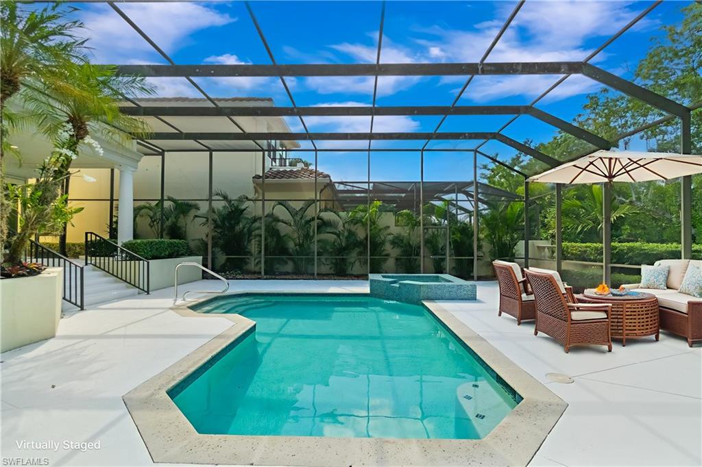 Revel in the pinnacle of luxury estate living within Vizcaya at Bay Colony in Pelican Bay. This highly sought-after and rarely available property presents an exceptional opportunity to own in one of Naples’ most exclusive and private enclaves. Featuring five bedrooms, four-and-a-half baths, a loft, and over 4,600 square feet of living space, this elegant residence blends timeless architecture with relaxed sophistication. The spacious living room, centered around a wood-burning fireplace, opens to an expansive outdoor retreat with a sparkling pool, spa, and tranquil views, ideal for entertaining or quiet relaxation. The primary ensuite on the main level showcases a beautifully remodeled, spa-inspired bathroom, while the 2012 addition created an upper-level guest wing offering exceptional privacy for family and visitors. Additional highlights include zoned HVAC newly installed in 2022 and generous storage throughout. Tucked behind a manned gate, Vizcaya at Bay Colony is an intimate enclave celebrated for its lush tree-lined streets, meticulously maintained landscaping, and enduring architectural charm. Residents of Bay Colony enjoy a private, residents-only Beach Club featuring a full-service beachfront restaurant and bar, poolside and beachside food and beverage service, an ocean-view bar perfect for sunset gatherings, and exclusive tennis facilities providing a true resort-style experience steps from home. Beyond Bay Colony, residents also have access to the exceptional amenities of Pelican Bay, including a state-of-the-art fitness center, group exercise classes, wellness programs, scenic walking and biking paths, kayaking, and an active tennis program. New pickleball courts are also underway, offering residents additional opportunities for recreation and enjoyment in the near future. Perfectly positioned near the luxury boutiques and restaurants of Waterside Shops and the cultural treasures of Artis-Naples, Vizcaya offers effortless access to the vibrancy of Mercato, the charm of Fifth Avenue South, and the pristine Gulf shoreline, making it one of Naples’ most coveted addresses.