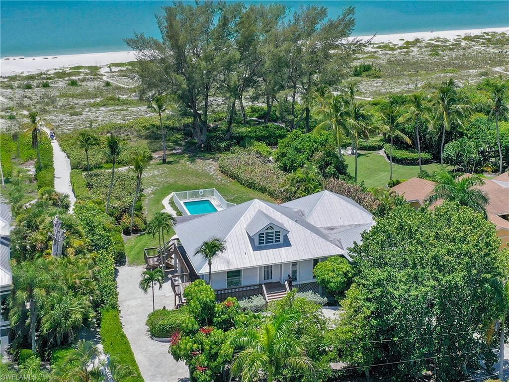 Excellent opportunity in beautiful Chateaux Sur Mer. Lot size 1.84 Acres! This four bedroom home has breathtaking views of the Gulf of Mexico and affords privacy. Large great room with cathedral ceilings opens up to spacious screened lanai overlooking the beach. The kitchen is open to the living area and boasts a SubZero refrigerator and dumb waiter. The master retreat is beachfront and includes his and her bathrooms. 3 guest bedrooms each with their own upgraded bathrooms. Wood floors thoruhgout, gulf front swimming pool, raised circular driveway, 2-car garage and so much more. Offered furnished! Make 4701 Rue Belle Mer your island escape.