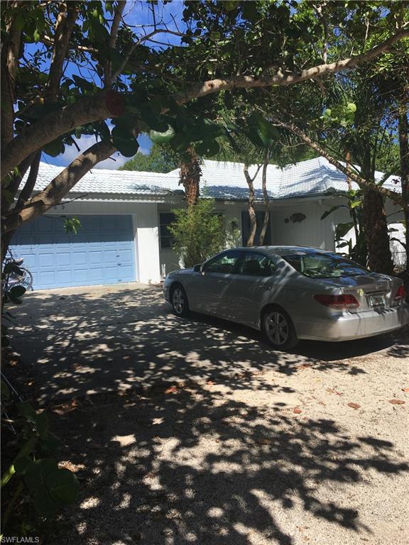 This canal front, three-bedroom, two-bath home features a large caged-in pool. This residence is located on Sanibel's West End and is just a short distance to the beach.