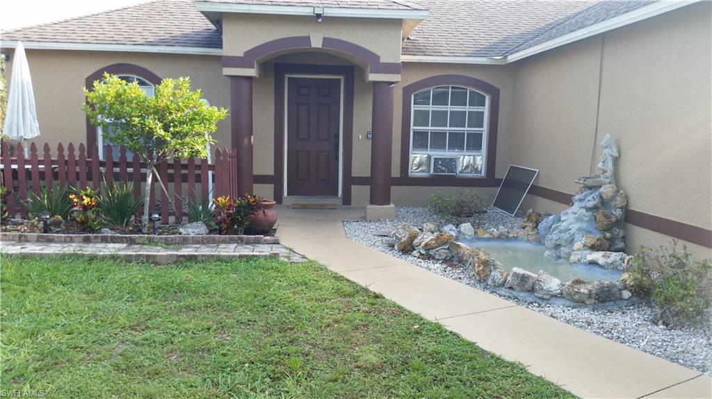 Price reduced. Seller financing options available for this Golden Gate 5 bedroom, 2 bath home that makes great use of the narrow, deep lot size with an above ground pool with walk-around deck, man-made pond, and 3 outbuildings. Storage building with 3 doors measuring 9 foot wide by 30 foot long with electric to the unit. Under roof (pole-barn type) workshop with electric & water - measuring 9 foot wide by 32 foot long. Smaller under-roof gazebo-style structure measures 10 foot X 10 foot. All of this on 1.14 acres AND UNDER $300,000.00. Stainless steel appliances in a traditional classic u-shape kitchen. Small water feature by the front door. Please note that the double car garage was converted by the owner into 4 smaller rooms: a storage room, laundry room, and 2 bedrooms - all permitted & inspected by local building authorities. Main house needs TLC and finishing touches. It's a little rough around the edges. All work was permitted and inspected by local authorities, and installed by the Seller.