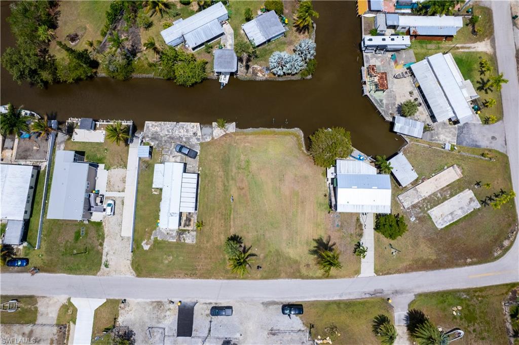 Exceptional waterfront opportunity on Plantation Island! This cleared double lot offers approximately 8,864 sq ft with direct canal frontage and quick boating access to the Gulf of Mexico and the Ten Thousand Islands.

This property is build-ready with extensive fill already brought in and a raised pad in place—saving significant time and cost for future construction. City water and electric are already available on site, adding even more value and convenience.

A proposed site plan for an elevated single-family residence is available, and prior plans were designed for approximately a 2,500 sq ft home, giving buyers a strong starting point for design and development (subject to buyer verification and current permitting requirements).

Located in a quiet waterfront community in Plantation Island, this property offers the ultimate Old Florida lifestyle with world-class fishing, boating, and natural beauty right outside your back door.

The combined double lot provides added flexibility for building, parking, and outdoor living space—an increasingly rare find in this area.

Whether you’re looking to build a private getaway, full-time residence, or investment property, this is a unique opportunity to own a waterfront parcel that is already well-prepared for development.

Buyer to verify all building requirements and regulations with Collier County.