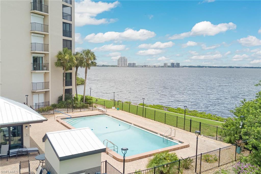 Discover Lee County’s best-kept secret! This stunning, newly updated 2-bedroom, 2-bath condo is tucked away behind a 24/7 guard-gated entrance and offers million-dollar riverfront views of the Caloosahatchee River and downtown Fort Myers. With a desirable split floor plan and tasteful upgrades throughout, this move-in-ready home is just waiting for you—bring your suitcase and start enjoying the Florida lifestyle. And the HOA fees are really low! They are almost HALF of the price of Fort Myers waterfront condos and the views are just as incredible - the taxes are lower too! And there is a free trolly that drops you off directly downtown Fort Myers so you can take advantage of all the events, dining & entertainment, but not have to worry about the traffic or parking. And the new pedestrian bridge makes access to downtown even easier! The condo itself has a spacious primary suite that features serene river views, sliding doors that open to the balcony, his-and-hers built-in closets, and an en-suite bath with granite countertops and a walk-in shower. The beautifully updated kitchen is both stylish and functional, offering stainless steel appliances, new granite countertops, and a cozy breakfast nook. Step out onto the private balcony to unwind at sunset and watch dolphins and native wildlife pass by. Recent upgrades include new impact windows, electric hurricane shutters, a tankless water heater, plantation shutters, and a brand-new roof (2024). The condo also comes with a covered, assigned parking space and a bonus storage room for added convenience and a full size washer and dryer in the unit. Located at the end of a peaceful cul-de-sac, this well-maintained gated community offers a heated pool, clubhouse, and meticulously landscaped grounds for your enjoyment. All of this, just minutes from the shops, dining, and social scene of downtown Fort Myers. Don’t miss your chance to own a piece of paradise—call today to schedule your private showing!
