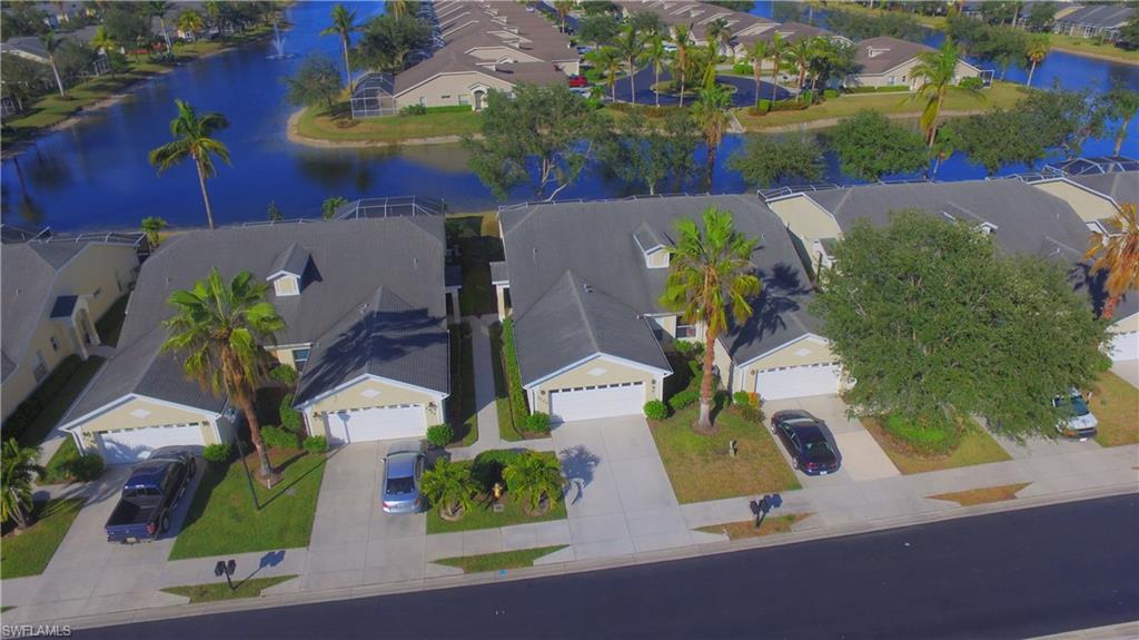 Beautifully updated and maintained home in popular Ibis Cove! Enjoy updated cabinets throughout - kitchen and baths. Kitchen has more than 40% additional storage space with 42" tall upper cabinets and extra cabinets beyond oven range. Granite counter compliment the kitchen and baths and are enhanced by upgraded under-mount sinks. Stainless appliances are a plus in your gourmet kitchen. Upgraded flooring through out is either tile - kitchen and baths - or rich toned laminate in living areas and bedrooms. Freshly painted throughout in a neutral color - even garage floor has been professionally painted. Ceiling fans with lights in living area and all bedrooms. You will appreciate all the fine appointments. Relax and enjoy the beautiful long lake views from both directions on your oversized Lanai! A/C Air handler in 2017. All this in a community which has a lot to offer in way of low quarterly fees - just $825 per quarter and amenities for all to enjoy. Shopping is close at hand - Publix Supermarket just around the corner, Super Walmart and Target minutes away near the convenient access to I-75. Beaches are west on Immokalee Road - 15 to 20 minute drive.