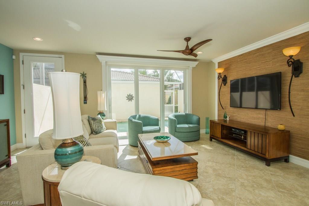 Beautifully decorated, Southern exposure and like-new townhome with private pool and 2 car garage. From the moment you walk through your new front door, you will be so happy this was your choice for a Florida home.  This 3 bedroom, 3 full bathroom residence has tile on the diagonal downstairs in all areas, a lovely living room with fabulous decorator touches, Hunter Douglas & Plantation Shutters for window coverings, terrific lighting fixtures and a great dining area for entertaining.  Your kitchen has granite counters, tile back splash and stainless steel appliances with a walk-in pantry offering plenty of storage. A Lower level bedroom is being used as a den and offers an en-suite bathroom too.  Upstairs are 2 master suites; one with a balcony overlooking the lovely lake, bridge and walkways and a bathroom with shower and dual vanities.  The other master suite offers dual vanities and combination tub/shower.  Both bedrooms have Plantations Shutters on the windows.  Relax outside next to your private pool and start to soak up the sunshine! VillageWalk in Bonita Springs offers amazing amenities and activities, a restaurant, gas station, fitness room, tennis, swimming pool and more.