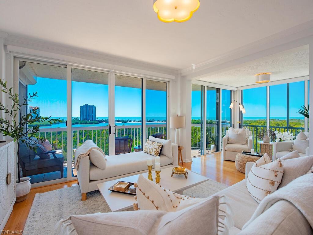 PANORAMIC VIEWS! Don't let the 5th floor fool, you these views are spectacular. This stylish residence showcases stunning year-round SUNSETS with GULF and BAY views! Designed to maximize natural light and coastal living, offering 2 Bedrooms + Flex/Den space and 2 Full Baths, the open floor plan features oak flooring throughout the main living areas and a split-bedroom layout that allows privacy for guests. St Tropez welcomes you with its renovated coastal chic lobby and resort style amenities, including two guest suites, a large pool, spa, sauna, poolside grills, social room, fitness room, tennis courts and the benefit of a dedicated on-site property manager. Ideally positioned right on the Pelican Bay “berm”, for quick and effortless BEACH access. As a Pelican Bay resident, you’ll experience unrivaled amenities: two private BEACHFRONT restaurants/bars, attended beach service, fitness center, 18 Har Tru tennis courts, 10 pickleball courts, kayaking, biking, and miles of scenic nature paths. Artis Naples, Waterside Shops, Olde Naples, and Mercato are just minutes away.