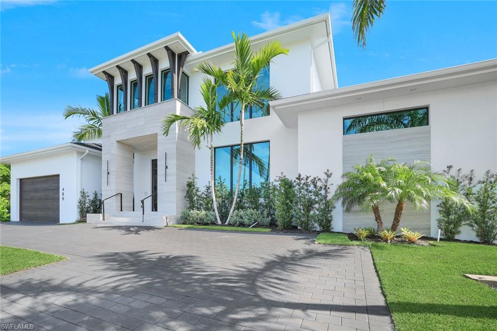 Welcome to Marco Island's newest model home brought to you by Braun Builders. This home consists of 5 bedrooms, 5 1/2 baths, including a bunk room, loft sitting area, and a spacious outdoor area with spectacular views perfect for entertaining. Construction and finishes are consistent with Braun Builders quality, featuring first and second story concrete construction, all poured exterior lanai decks, custom cabinetry, closets, and wall and ceiling features throughout. The home has Thermador appliances, 3 A/C units, a whole home generator, and an elevator. Designer furnished

Agent related to seller