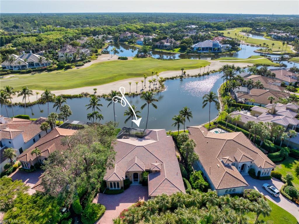 Welcome to this perfectly placed residence, located in the quiet neighborhood of Venezia, within the private, gated community of Grey Oaks. Boasting IMMEDIATE GOLF MEMBERSHIP, this home offers unparalleled views of the stunning 16th Fairway on the Palm Course, complemented by sweeping lake vistas. The Bird Sanctuary is very close by, so you will be entertained daily by swooping pelicans, herons, and other Florida wildlife, as you sip coffee on your lanai and another lovely day in paradise unfolds. Enter this gracious home with its voluminous ceilings, abundant crown moldings, and neutral tile flooring in main areas. The primary suite has relaxing views to the lake and golf course, yet privacy with the landscaping and distance. The gourmet kitchen opens to the breakfast area and family room, with incredible vistas and an abundance of sliding glass doors and windows to let the sunshine spill in. The chef in you will enjoy whipping up dinner in this spacious kitchen with gas range, while the outdoor grill is steps away. After a round of golf or pickle ball game, take a dip in the pool, and relax poolside with your favorite beverage, taking in the picturesque views as herons and egrets glide by. This home has hurricane shutters throughout, a 2-car garage plus room for a golf cart, tankless water heater, and a floor plan that can easily be remastered into a four bedroom/four bath home. The great floor plan is the perfect palette to redesign it into your dream home with your inspirations and colors.  The location of this home is truly spectacular, with quiet and incredible vistas that do not become available often.  Grey Oaks Country Club is a world-class club, with an extensive, varied social calendar, where one can meet so many great Members, which make this community such a wonderful place to call home.  Amazing amenities include a 30,000 sq. ft. Wellness Center and Spa, resort pool, two clubhouses, three restaurants, three golf courses, a new pickleball center, bocce courts, tennis, and a vibrant social scene for residents to enjoy. Ideally located in the heart of Naples, this residence is just minutes from pristine beaches, downtown, shopping, and dining. Whether you're hosting guests or enjoying a quiet evening in, this home offers the ultimate in luxury living. Welcome home to Grey Oaks - where your dream lifestyle awaits.