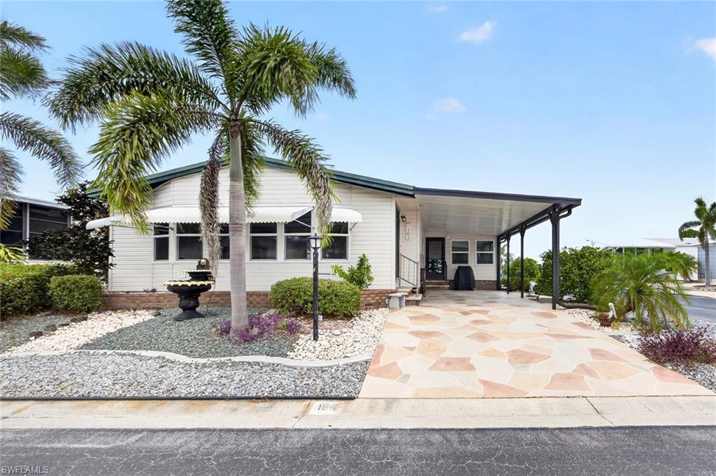 PRICE IMPROVEMENT! CORNER LOT! FURNISHED 55+ 2 BEDROOM, 2 BATH, CARPORT MANUFACTURED HOME IN BURNT STORE COLONY. Share certificate valued at $32k. This home features well-manicured landscaping with low-maintenance rock beds, newer roof (2022), and a flagstone-pattern driveway leading to the front door. Step inside, and you’re greeted by an open-concept formal living and dining area filled with natural light. The light coastal palette creates an inviting and serene ambiance. The living room includes built-in bookshelves and cabinetry, while the dining room features a built-in china cabinet, adding both charm and functionality. Spacious kitchen features white cabinetry, solid surface countertops, a skylight, and a window above the sink that frames a lovely view. Designed for both everyday living and entertaining, the space also includes an island, a closet pantry, and a cozy dinette area with built-in cabinetry and shelving perfect for a wet bar setup. Adjacent to the kitchen, a sunlit family room offering dual entry points, one leading to the driveway and the other to the back of the home. It’s a versatile space ideal for relaxing or gathering with friends. Generous primary complete with direct access to the screened-in patio and an ensuite bath featuring dual sinks, a walk-in tile shower with decorative stained-glass windows, a private water closet, and a spacious walk-in closet. Guests will feel right at home in the generous guest bedroom, which offers direct access to the guest bathroom. Step outside to the screened-in patio at the back of the home, offering the perfect setting for al fresco dining, entertaining, or simply unwinding with a good book. Just beyond the patio, you'll also find ample outdoor storage with both a regular utility shed and an extra golf cart shed. Burnt Store Colony enhances your lifestyle with an array of amenities, including a gym, library, screened lap pool and spa, tennis and pickleball courts, shuffleboard, dog park and two clubhouses with a full-service kitchen and entertainment space. Located just 20 minutes from downtown Punta Gorda and 30 minutes from downtown Fort Myers. Additionally, it's close to Heritage Landing and Burnt Store Marina, offering access to resort and golfing facilities, waterfront dining, and entertainment. It is conveniently located to the airport, restaurants, shopping and award-winning fishing and boating. Don't miss out on this opportunity!