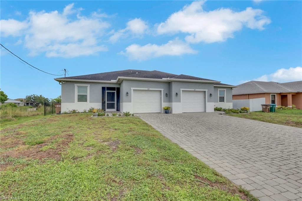 Rare Opportunity! These custom-built attached villas are being offered for sale simultaneously and must close together—either to one buyer purchasing both homes or to two buyers purchasing at the same time. Unlike a traditional duplex, each residence is individually parceled and can be financed with its own mortgage, allowing each owner to enjoy the privacy and independence of homeownership while living next door to family or close friends.

Welcome to 1519 NE 8th Place, Cape Coral, where quality craftsmanship, thoughtful upgrades, and waterfront living come together at an incredible value. Built in 2020, this beautifully appointed 3-bedroom, 2-bath attached villa offers the luxury and feel of a custom home with the affordability and convenience of low-maintenance living.

From the moment you arrive, you'll appreciate the inviting screened front porch, paver driveway, and exceptional curb appeal. Inside, soaring 10-foot ceilings, elegant crown molding, granite countertops, a large farmhouse kitchen sink, and tile flooring throughout create a bright, open living space designed for both comfort and style.

The spacious kitchen flows seamlessly into the living room, where impressive three-panel sliding glass doors open to an extended screened lanai overlooking a peaceful freshwater canal. Step outside to enjoy your morning coffee, entertain friends, or simply relax while taking in the waterfront views. A shared concrete dock provides direct access to the freshwater canal, making it easy to kayak, fish, or enjoy Southwest Florida's outdoor lifestyle.

The spacious primary suite features dual vanities, a luxurious floor-to-ceiling tiled walk-in shower, and a large walk-in closet. An oversized one-car garage provides additional storage, while the fully fenced backyard offers privacy for pets and outdoor entertaining. Best of all, this home is not located in a flood zone, providing added peace of mind and potential insurance savings.

Originally custom built by the current owners so they could enjoy luxury living side by side, both villas feature the same thoughtfully designed floor plan and identical high-end finishes. Whether you're looking to purchase both homes for investment or multi-generational living, or you're coordinating with parents, adult children, siblings, or close friends, this is a truly unique opportunity. Each residence can be owned, financed, and mortgaged separately, allowing every owner to enjoy the benefits of independent homeownership while living next door to the people who matter most.

Luxury finishes. Waterfront living. No flood zone. Individual ownership. A one-of-a-kind opportunity—all for just $259,999.