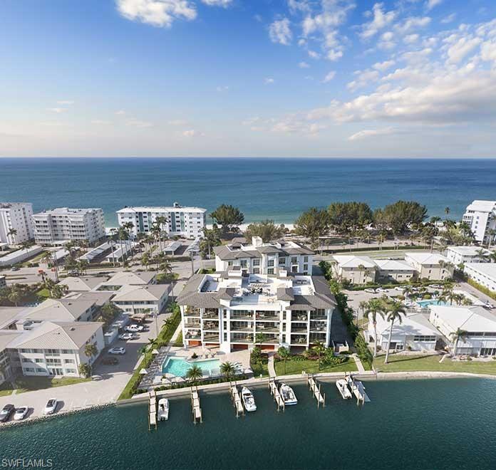 Introducing 2020 Gulf Shore-an exclusive collection of just 15 residences positioned between The Gulf and a private harbor within the Moorings, one of Naples' premier neighborhoods. Developed by Baron Collier Companies and Golub and Co. two names deeply rooted in Naples' history and luxury developments, this boutique community blends legacy, design and effortless living. Interiors by Soucie Horner Design Collective bring a refined coastal aesthetic with top-tier finishes, 10' ceilings, direct elevator access, expansive glass, custom cabinetry, and curated natural materials throughout the home. Thoughtfully designed outdoor living spaces include built-in Wolf grills, generous terraces, integrated hurricane screens for year round comfort. A frictionless ownership experience is supported by available turn-key furniture packages and elevated al-a-carte services through Juniper Holiday+ Home, offering concierge support, home watch, provisioning and more-ensuring true ease from day one. Amenities include a bayfront resort style pool, two roof top terraces with Gulf and Bay views, a dedicated kayak /paddleboard launch, 11 boat slips for vessels up to 32 feet, fitness areas, and secure under building parking with EV charging. Located in the Moorings, residents enjoy quick access to Moorings Beach Club, walkable beach paths, a short golf cart ride to 5th Ave shopping and dining and a short walk to the New Four Seasons Hotel. Here, waterfront living is elevated by thoughtful design, premier finishes, and a rarely offered level of convenience.