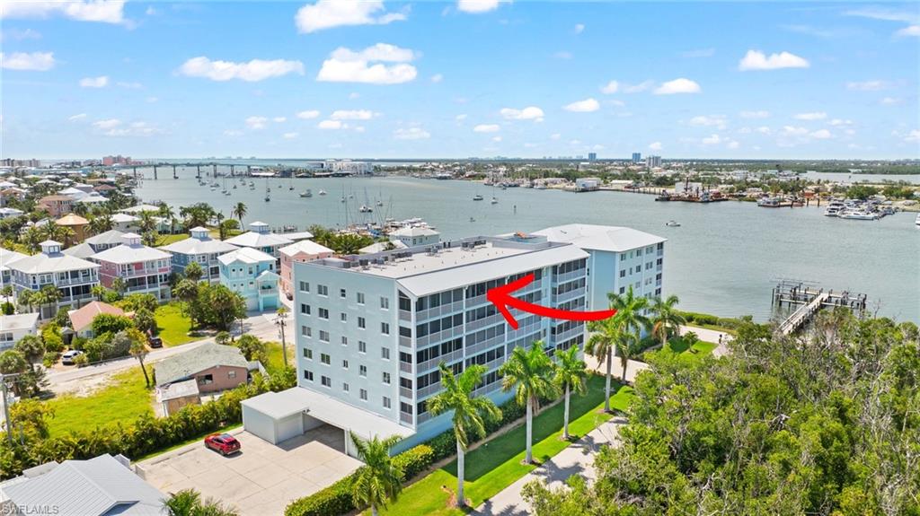 Welcome to waterfront living on Fort Myers Beach! This condo offers a rare opportunity to add your personal touch and create real value in one of Southwest Florida's most sought-after coastal communities. The big-ticket items are already in place, including a brand new 2025 water heater, a 2023 roof, and fire sprinklers in the unit for added peace of mind. Step out to the balcony with new screens and take in your slice of the coastal lifestyle. Boaters will appreciate the deeded boat slip #9, offering 34.5 feet of space and easy access to the water. A covered parking spot sits conveniently near the elevator for everyday ease. As Fort Myers Beach continues its strong resurgence and reinvestment, units like this are positioned to grow right along with the area. With great structure and an unbeatable location, this is your chance to design the coastal retreat or investment property you've been envisioning. ***See video at virtual tour link***
