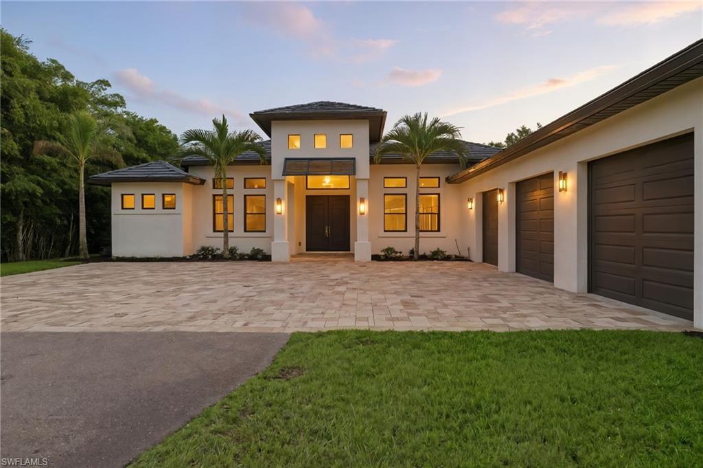 Welcome to the perfect blend of space, privacy, and modern luxury at 5710 Spanish Oaks Boulevard, an exceptional 2019-built home in the highly sought-after Oakes Estates, one of North Naples’ premier acreage communities celebrated for its peaceful setting and absence of HOA restrictions.

Set on 1.59 fully fenced acres, this property offers the rare combination of contemporary construction, refined finishes, and flexible outdoor space. A private electronic gate and long drive lead to a home that exudes quiet sophistication and comfort.

Inside, you’ll find four bedrooms plus a den, three full baths, and over 3,000 square feet of open, light-filled living space with marble floors, 12–14-foot tray ceilings, and elegant architectural details throughout. The kitchen features high-end Bosch appliances and flows seamlessly into the great room and lanai, creating an ideal environment for entertaining or everyday living.

Step outside to a resort-style saltwater pool and spa, complemented by a built-in outdoor kitchen and screened lanai designed for effortless Florida living. Beyond, the cleared rear lot offers endless potential, a guest house, tennis or pickleball court, or custom putting green could easily complete your private retreat.

Additional highlights include a fully air-conditioned three-car garage, whole-home reverse osmosis system, and custom built-in closets. Ideally located just 10 minutes from Naples’ world-class beaches, with easy access to I-75 and bikeable or walkable proximity to shopping and dining, this residence captures the very best of the Naples luxury lifestyle—offering space, freedom, and sophistication in one of the city’s most coveted neighborhoods.