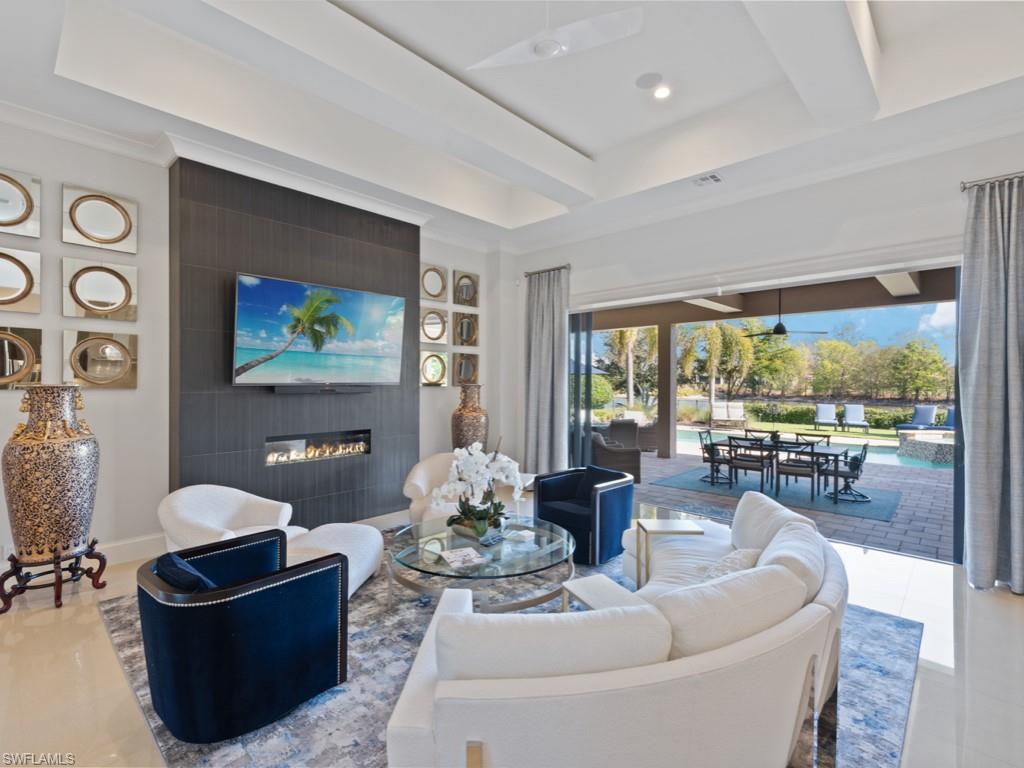 TRANSFERABLE GOLF MEMBERSHIP INCLUDED -  Price Reduced - Sophisticated elegance describe this stunning 4 bedroom, 4 bath, den/office, pool bath/powder room home in Quail West! Private lake view, no golf cart path, situated on 16th and 17th holes on the Lakes Course.  Chef's kitchen boasts zebra wood cabinetry, Sub Zero refrigerator, Wolf 6 burner gas cooktop, Miele coffee system, and huge walk-in-pantry. Climate controlled wine wall, built-in bar sink, ice maker, Thermidor refrigerator/freezer drawers.  Outdoor expansive lanai area with 2 fireplaces, outdoor kitchen and peaceful grassy yard.  Features new 2022 pool/spa heater, 7 TV's, LED lighting, Sonos system, hi-def speakers, whole house generator and water filtration system, 3 car garage with 2nd refrigerator/freezer/ice maker, 2021 A/C, storage, Smart electric hurricane screens, impact windows and other shutters complete this stunning home! Quail West 70,000+ sq. ft Award Winning Club House with two-18 championship golf courses, fitness, indoor pool, lap pool, sauna, steam, full-service spa salon, tennis, pickleball, bocce,  Multiple restaurants, Marketplace for Pizza, Breakfast & Even Flowers!! Exclusion List To Be Provided.