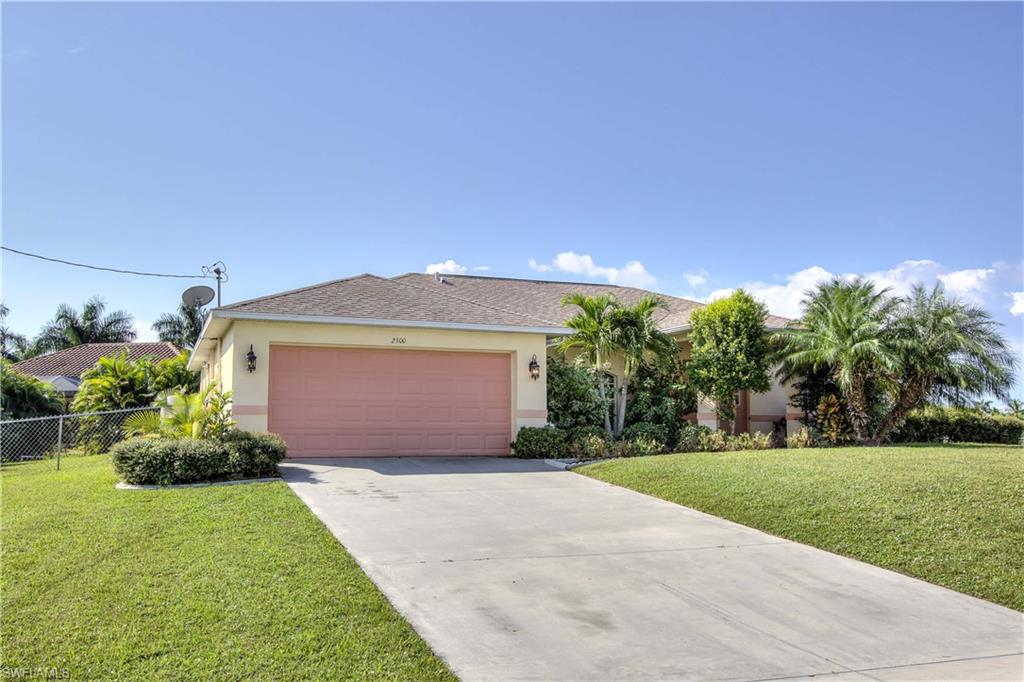 Natural light abounds in this well maintained pool home located in the Coral Oaks neighborhood of North West Cape Coral. This home features three bedrooms with a large den accented by French doors and two full bathrooms. The two guest bedrooms share a Jack and Jill bath perfect for a family or visitors. The spacious master bedroom flows to an en suite bath boasting a soaking tub and a separate tiled shower. The home cook will enjoy the cook's kitchen featuring all wood raised panel cabinets, stainless steel appliances, a center work island, and plenty of counter space with convenient adjacent dining room. Cool off in the pool or soak up the Florida sun on the spacious stamped concrete deck fully enclosed by screen. A spacious under truss lanai provides plenty of shade and space to entertain or dine al fresco. Surrounded by mature tropical landscaping and custom curbed flower beds you are immersed in the Florida lifestyle. Located just steps from the Coral Oaks 18 hole golf course and minutes to the Burnt Store boat ramp, area parks, famous Matlache artist colony, world class fishing and the shopping/dining of the Pine Island corridor. Come and take a look you wont be disappointed!
