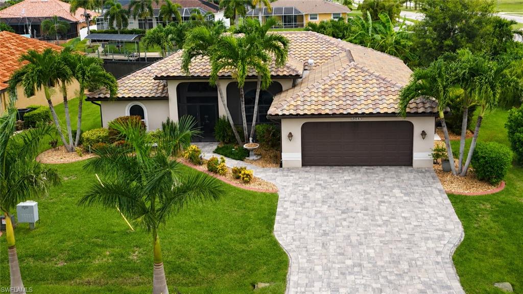 Presenting 2028 SW 44th Terrace, a Gorgeous Waterfront Pool Home in SW Cape Coral! This Furnished, Move-In Ready Stunner Is in a NO FLOOD ZONE & Loaded w/New Improvements to Include: A Paid OFF Electric Solar System, Tile Roof, Pool Cage, Driveway & Lanai Pavers (2023); Kitchen Appliances & Range Hood, Accordion Impact Windows/Doors in BD/BA/KIT w/Lifetime Warranty & Front Screen Enclosure (2024); Front & Back Electronic Shutters & LVP Bedroom Flooring (2025) & Garage Door Opener (2026). Other Upgrades Include: A Gulf Stream Pool Heater, an Outside Shower and Garage Built-Ins w/Workspace & a Tesla Charger.  This Southern Exposure Oasis also Boasts a Large, Corner Lot w/an Expansive Yard, Automatic Sprinkler System, Mature Tropical Landscaping, a Myriad of Fruit Trees & Royal Palms, a Privacy Hedge & Planter Boxes Galore for the Avid Gardener. And the Oversized, Wraparound Dock Houses a 10K LB Boat Lift w/Ample Room for Seating to Enjoy the 150 Ft Canal's Sweeping Views. Beautifully Maintained w/So Many Extras. A Definite Must-See for Anyone Ready to Experience a Truly Exceptional SWFL Lifestyle. Welcome Home!