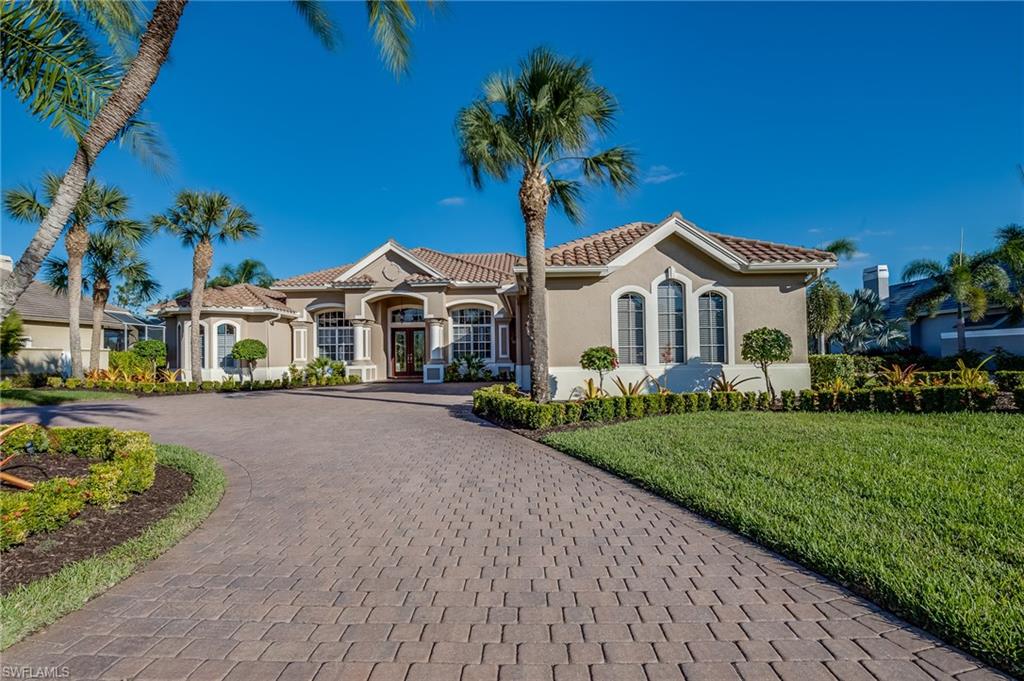 A spectacular home on an oversized lot that has many upgrades, including a new summer kitchen vented to the outside, picture frame lanai cage, upgraded stainless appliances, retractable sliders in the livingroom and familyroom, ADT hardware, audio speakers in the entire house with 4 premium speakers on the lanai, and so much more.  No upgrade was spared.  The view of the second hole of the Arnold Palmer designed signature golf course (owner's golf membership is available but not included in the price) and pond is awesome from the very large lanai that has 4 different seating areas.  This magnificent home shows beautifully and has been very well maintained.  Wildcat Run Golf & Country Club offers its residents the 18-hole golf course, har-tru tennis courts, state-of-the-art fitness center, two restaurants and a snack bar; best of all, its resident friendly.  Experience the Pride and make Wildcat your next home.