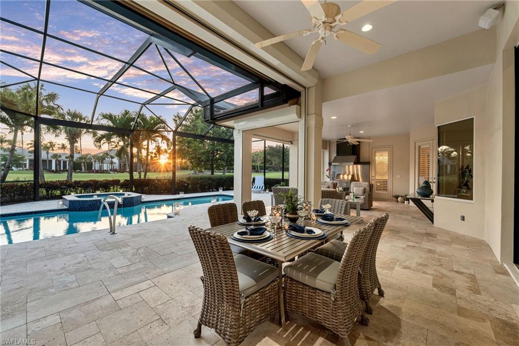 Welcome to your new home in the prestigious Grey Oaks community—where timeless design, modern upgrades, and expansive golf course views come together in perfect harmony. Overlooking the 13th fairway of the Pine Course, this beautifully-renovated residence offers an ideal blend of size, sophistication, and style.  Step through the impact-rated front entry doors into a bright, open-concept floor plan where walls have been removed to create a spacious, airy flow between the kitchen, living, and dining areas—all oriented toward the expansive lanai, resort-style pool, and panoramic golf course vistas.  The remodeled kitchen is designed with entertaining in mind, and features quartz countertops, a large center island, gas range, upgraded cabinetry, and stainless steel appliances. Whether preparing a casual brunch or hosting a cocktail party, this kitchen is the heart of the home.
The primary suite is a serene retreat, with views of the pool and golf course. The spa-inspired primary bath has been tastefully updated with quartz countertops, a generous walk-in shower, new fixtures, designer lighting, and impact windows for peace of mind and natural light.
The two guest bedrooms offer comfort, privacy, and each guest bath has been reimagined, and the rear guest room features French doors that open directly to the pool and lanai-perfect for visiting family and guests. This suite also includes an en-suite cabana bath, positioned to serve both the bedroom and guests enjoying the outdoor areas.
Outdoor living is elevated to an art form here. The completely redesigned lanai features an expansive, travertine deck with generous covered space for lounging, dining, and entertaining. A state-of-the-art outdoor kitchen includes a built-in Lynx grill with Thermador hood, stainless steel backsplash for easy cleanup, under-counter refrigerator, and ample prep space—ideal for al fresco meals after a round of golf.  As evening falls, enjoy custom-lit pool screening and extensive landscape lighting that creates an enchanting, resort-style ambiance. Picture yourself relaxing by the fire table, sipping a cocktail, and watching another spectacular Naples sunset. 
Additional features include new roof in 2019, a 2-car garage with separate golf cart space, automated hurricane shutters in back of home, hurricane-rated front doors, newer pool pump, heater, Jandy pool controls, automated sunshades, 2-zone HVAC system 2021 and offered furnished for immediate enjoyment. You will love living in Grey Oaks, which is one of Naples' premiere private communities, offering access to a 30,000 sq. ft. Wellness Center & Spa, resort pool, two clubhouses, three restaurants, three golf courses, a newly-designed pickleball center, bocce, tennis, and a vibrant social scene that creates a sense of community and camaraderie.  Centrally located in Naples, Grey Oaks is minutes from pristine beaches, world-class shopping, fine dining, and the charm of downtown. Welcome to Grey Oaks and welcome home!