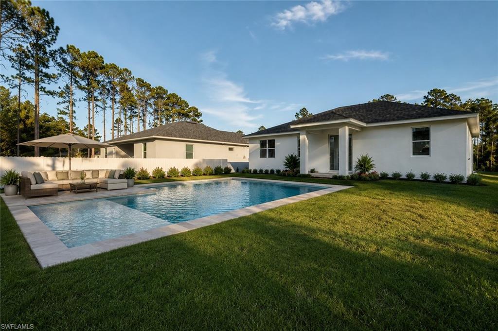 POOL IS RENDER!! / $10,000 Seller concessions towards buyer closing costs and prepaids.  This newly constructed home in the desirable 33971 ZIP code offers the best price per square foot in all of Lehigh Acres. Situated at 2709 34th St W, this property is designed for comfort and durability, built on an elevated pad to prevent flooding. Featuring 3 bedrooms + a den, 2 bathrooms, and an open floor plan with soaring 9-foot ceilings and 10-foot vaulted accents, this home is filled with natural light and modern finishes. Enjoy polished Venato porcelain tile flooring throughout, impact-resistant ECO WINDOWS, and sleek white quartz countertops in the kitchen. The spacious master suite boasts two walk-in closets and a luxurious freestanding shower with dual sinks. For peace of mind, the seller—who is also the developer—includes a 2-10 Home Builders Warranty (including a 7-year structural warranty). With easy access to I-75, this home is just minutes from Fort Myers, Southwest Florida International Airport, and the stunning beaches of Sanibel & Captiva Islands.    This home is ready for immediate move-in and a quick closing. Schedule your showing today!