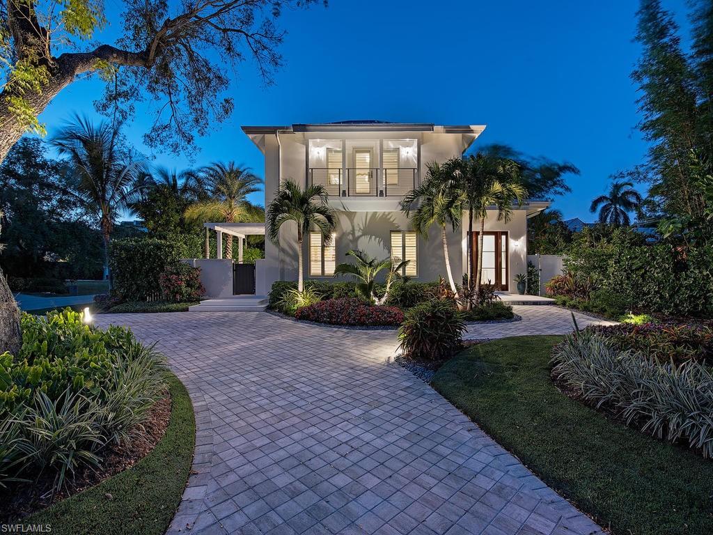 H.14347 - Absolutely stunning, coastal casual 4BR+Den/5 Full BA home with over 5000 Sq Ft of top-quality finishes and luxurious livability! Classic, tasteful, exquisite! Light & bright open concept with great room affords amazing space for entertaining. Built in 2015 this meticulously maintained home is better than new and loaded with upgrades! Wide plank wood flooring, plantation shutters. Gourmet kitchen w/Wolf & SubZero, lavish bathrooms, sumptuous 1000+ sq ft master suite with sitting area, HUGE walk in closet, a morning kitchen, separate water closets, and you can catch the sunset colors from your private, covered balcony overlooking the manicured yard. VIP guest suite on ground floor could be used as a first floor master, and provisions for a future elevator are in place. Storage galore with tons of built in cabinetry and closets and two laundry rooms. Lush, tropical landscaping and Palm Trees enhance the sleek, clean architecture, and provide shade for the lovely flower & herb gardens, privacy for the sun-bathed pool & spa. Right in the heart of Olde Naples on a charming Mahogany Tree lined avenue, just a short stroll to the beach. This is Naples at its best!