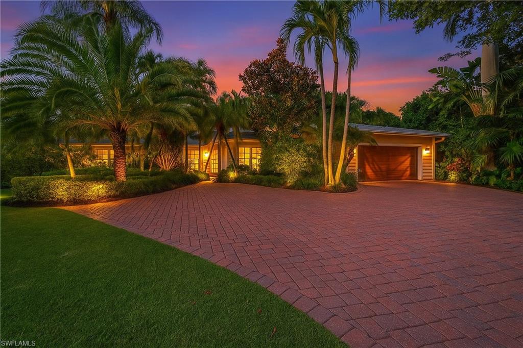 (Never flooded!) The only available Royal Harbor buildable homesite offering almost 200 feet of waterfront on a premier fingertip cul-de-sac. Positioned at a higher elevation than neighboring streets, ensuring added protection and peace of mind from hurricane surge. This exceptional property offers a brand-new roof, a freshly painted exterior, and a rare opportunity to live the ultimate Florida lifestyle. Whether you're a retiree looking for a beautifully renovated waterfront home or a visionary ready to design your dream estate, this property delivers the perfect canvas. With almost 200 feet of prime waterfrontage, this boater’s paradise features a new composite dock and two boat lifts, which could be easily adapted to accommodate a large yacht. Situated at a higher elevation, this home remained unaffected by Hurricane Ian’s flooding, ensuring peace of mind for future owners. Tucked away in a tranquil cul-de-sac with no through traffic, the property offers a private, serene setting with an enchanting blend of Old Naples charm and modern luxury. The interior is a masterpiece of design, with imported Italian cabinetry, elegant Italian tile flooring, and custom-cut granite throughout. Premium appliances from Wolf, Sub-Zero, Bosch, and Miele elevate the kitchen and living spaces. The spacious master suite features a custom open-closet system and a private patio overlooking the pool and expansive water views, perfect for enjoying stunning sunsets. The guest bath is a true sanctuary, complete with art glass tile and custom granite detailing. Step outside to your private pool and spa, surrounded by lush, meticulously designed landscaping, including towering palms and a park-like atmosphere. Whether relaxing by the water or strolling down to your dock to watch dolphins play, you’ll feel like you’re living in your own secluded paradise. With no-bridge access to the Gulf of Mexico, you can set sail from your backyard directly into the open waters. This is a rare opportunity to secure a prime waterfront location to live in now or build the home of your dreams. Don’t miss out—this property won’t last long.