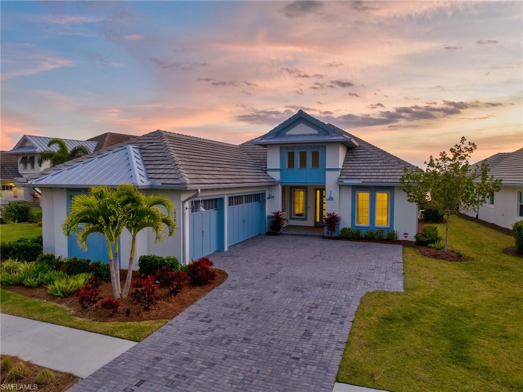 Discover luxury living in this Isles of Collier Preserve gem! Impeccably crafted through Stock Construction, this home harmonizes elegance with nature. Entertain seamlessly in the open living space with high ceilings and a gourmet kitchen featuring top-tier appliances. Step into your private oasis - a screened lanai overlooking lush landscapes, a dazzling lake view, and a refreshing pool and spa. Master suite indulgence with spa-like amenities and walk-in closets. Additional bedrooms and a dedicated home office cater to family needs. Outside, embrace Naples living with a clubhouse, walking trails, and fitness facilities. Isles of Collier Preserve offers a lifestyle defined by nature's beauty. Your dream home awaits, showcasing tranquility and sophistication.