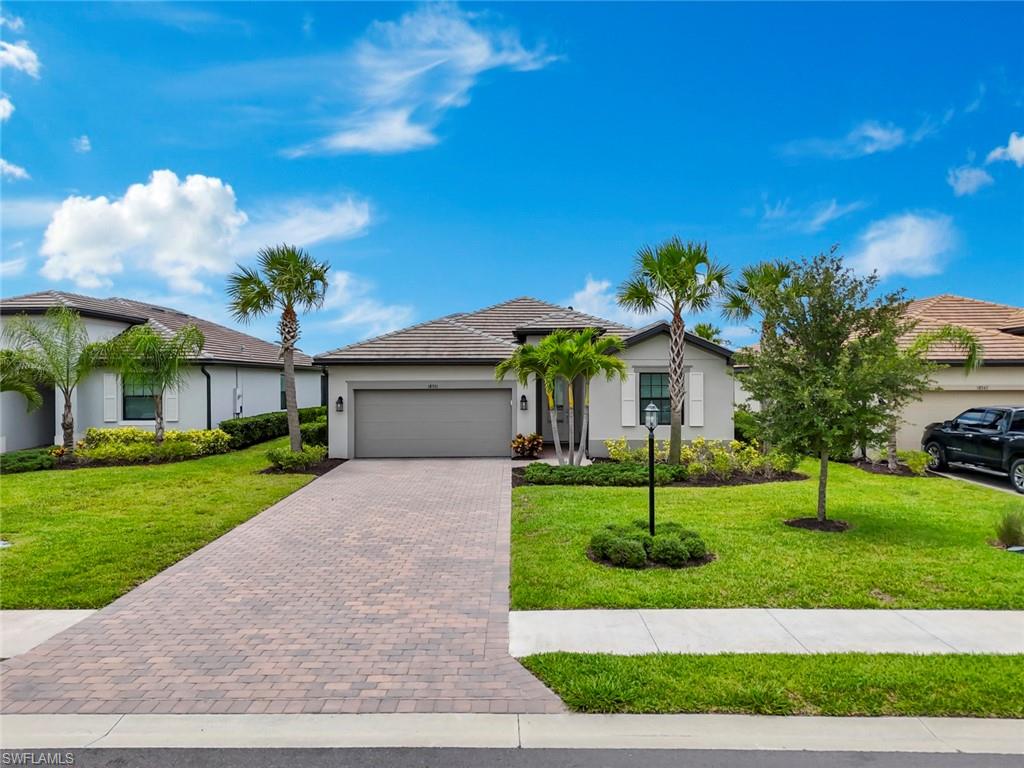 Experience resort-style living in one of Estero's most sought-after gated communities. This beautifully designed 4-bedroom, 3-bath home offers over 2,000 square feet of open-concept living space, thoughtfully designed for both comfort and entertaining. The spacious kitchen flows seamlessly into the dining and family rooms, creating the perfect setting for gatherings, while the covered lanai extends your living space outdoors while staring at the lake and beautiful sunsets. All rooms feature high-end designer furniture. The luxurious primary suite offers a private retreat with generous walk-in closets and a spa-inspired bath designed for relaxation. Additional bedrooms provide comfortable accommodations for family, guests, and a dedicated home office. Step outside to the covered lanai and enjoy Florida's year-round sunshine while overlooking the beautifully maintained surroundings. Whether sipping your morning coffee or unwinding after a day at the beach, this outdoor living space enhances the home's relaxed yet refined atmosphere. As a resident of Verdana Village, you'll enjoy access to an unparalleled collection of resort-style amenities, including a spectacular clubhouse, expansive pools, state-of-the-art fitness center, indoor and outdoor pickleball and tennis courts, basketball courts, on-site dining, a café, dog park, and playground. Ideally situated just minutes from Southwest Florida International Airport, Gulf Coast Town Center, Coconut Point, world-class golf, fine dining, and the pristine beaches of the Gulf, this residence offers the perfect balance of convenience and luxury.