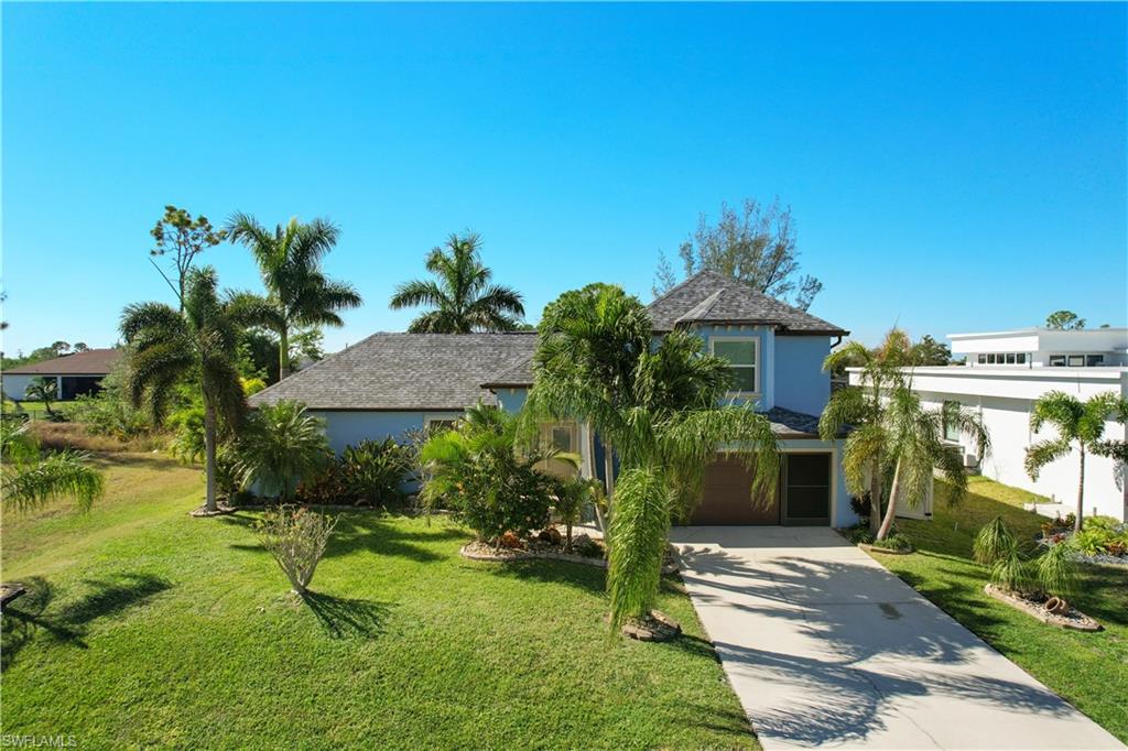 Freshwater Front Home with Lush Tropical Landscaping – Not in a Flood Zone!

Experience the best of Florida living in this beautifully maintained 3-bedroom home with a versatile den/office, perfectly situated on a peaceful freshwater canal. Designed with both comfort and style in mind, the open floor plan creates a bright, spacious atmosphere that's ideal for everyday living and entertaining.

The well-appointed kitchen flows seamlessly into the living and dining areas, making it easy to gather with family and friends. Step outside to the inviting lanai, where you can relax and enjoy the tranquil waterfront setting or host memorable outdoor gatherings.

This home has been thoughtfully updated with numerous improvements, including:

* New roof (2022)
* Fresh exterior paint
* PGT hurricane impact windows and doors
* New insulated, hurricane-rated garage door
* Generator hookup at the main electrical meter
* Mini-split air conditioning system in the garage for year-round comfort
* Composite decking on the upper deck with a maintenance-free vinyl railing system and illuminated post caps
* Full irrigation system to keep the lush tropical landscaping thriving year-round

The spacious primary suite offers a relaxing retreat with a soaking tub, separate walk-in shower, and generous layout.

Best of all, this property is **NOT LOCATED IN A FLOOD ZONE**, providing added peace of mind while still enjoying the beauty of freshwater frontage.

With exceptional upgrades, stunning outdoor spaces, and a prime waterfront location, this home truly has it all. Schedule your private showing today and discover everything there is to love about this exceptional property!