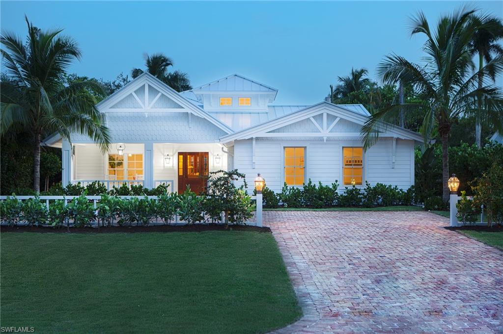 Just Completed!! This wonderful Smart Home has been completely renovated by award-winning designer, Kristen Williams. A transitional floor plan offers vaulted ceilings over a generous amount of indoor and outdoor living space for family time and entertaining.  The designer has revived this quintessential Old Naples cottage into a cleaner, simpler coastal look that also provides a sense of serenity.  A gourmet kitchen, featuring a Lacanche duel fuel range, has a large island covered in Mystery-white marble, and an abundance of storage. There is also a first floor study. The owner's suite is made complete with his and her walk-in closets, a bath with a custom vanity, duel sinks, a soaking tub, and large shower.  All other bedrooms en suite. Visitors will never want to leave the generously spaced second floor guest area which is a great flexible space. The fresh, and open, family room leads to a covered lanai made complete with an outdoor kitchen and a sitting area overlooking a spacious yard.  The pool and spa are each surrounded by shell stone and under southern exposure. See Floor Plan under Supplements.
