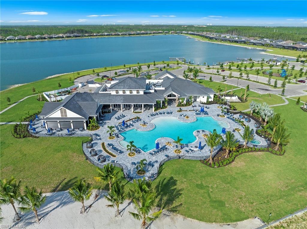 Prime Estero/S.Ft.Myers Location & Resort Style Living in Highly Desirable WILDBLUE Waterfront Lake & Boating Community near Everything! Beautiful and Spacious Home with 3 Bedrooms + Den/Study, 3 Full Baths, 3 Car Garage Home with Natural Preserve and Water Views. Designer Ready! Enjoy your Private Gas Heated Pool & Spa, Huge Covered Screened Lanai with Summer Kitchen including Built-in Gas Grill and Refrigerator and direct access to Full Pool Bath with Walk-in Shower. Kitchen is perfect for a Chef with Gas Cooktop, Wall Oven & Microwave, Huge Island with Sink, Quartz Countertops, Lots of Wood Soft-close Cabinetry, Pantry with Slide-out Shelves and Open Space to Great Room with Full Glass Sliders to Pool and Covered Porch. Tile throughout, Soaring Ceilings. Den/Study with Glass French Doors. Primary Suite with Tray Ceiling, Sliders to Pool Area, Walk-in Closet, Dual Vanities, Separate Tub and Walk-in-Shower. Guest Suite with direct access to Full Bath, additional Full Bath and Bedroom. Large Laundry Room with Gas Dryer, Washer, Built-in Cabinetry & Sink, Quartz Counters. World Class Amenities includes, Fitness Center with Lakefront Exercise Room and Classes, Lap Pool, Lockers, Sauna and Showers,  Racquet Sports/ Pickleball and Tennis with Trainers Available, Yoga & Fitness Classes, Bocce Ball, Outdoor Bar area and on-site Spa Services. Minutes to I-75, SWFL, Regional Airport/RSW, FGCU, areas best Shopping, Restaurants, Schools, Parks, Theater, Golf Courses, Naples, Bonita Springs and more. Must see Lakefront Indoor & Outdoor Restaurants & Bars, Sandy Beach, Boat Ramps & Docks, Community Rooms, Wildblue Lake for Boating and Watersports including Skiing and Fishing.